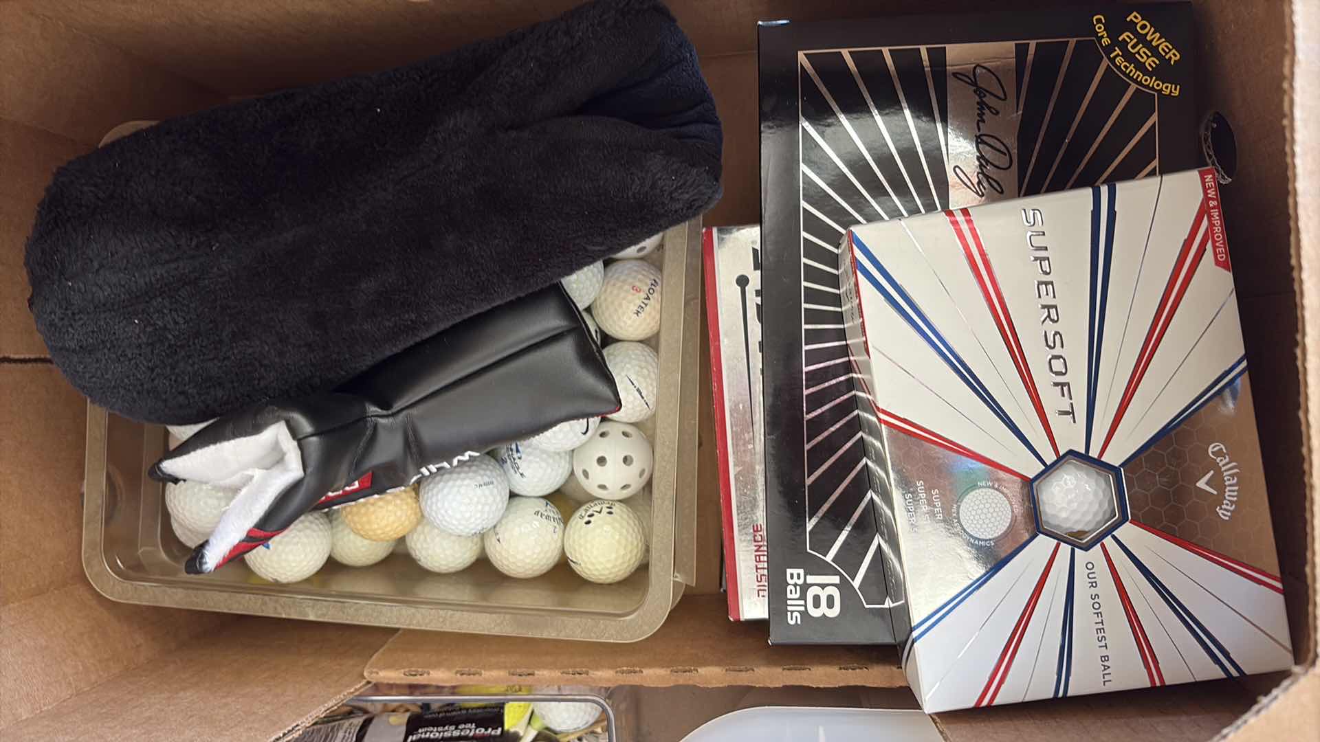 Photo 1 of BOX OF GOLF BALLS AND CLUBS L44” $230