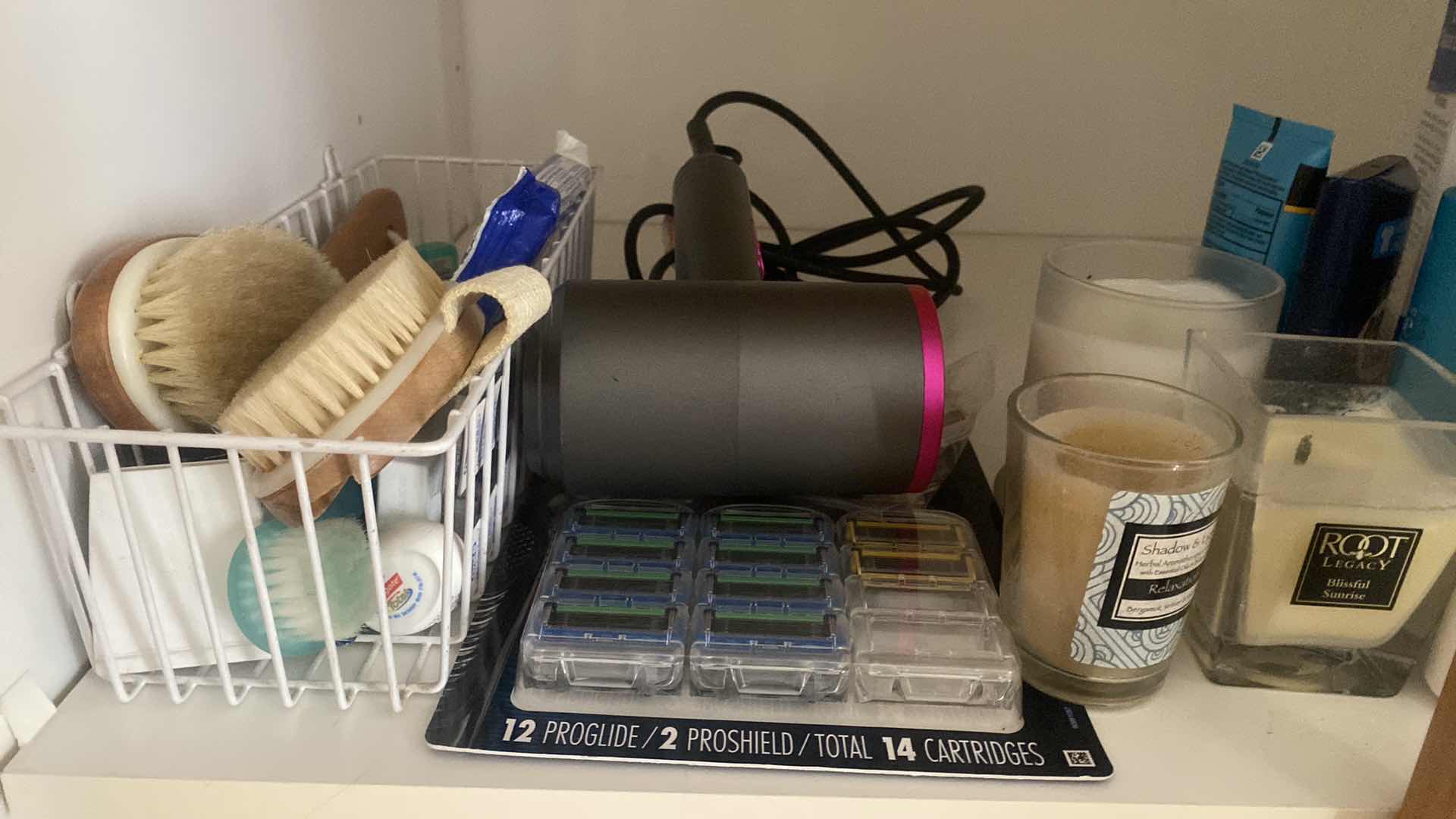 Photo 1 of CONTENTS OF CABINET PERSONAL CARE & CANDLES