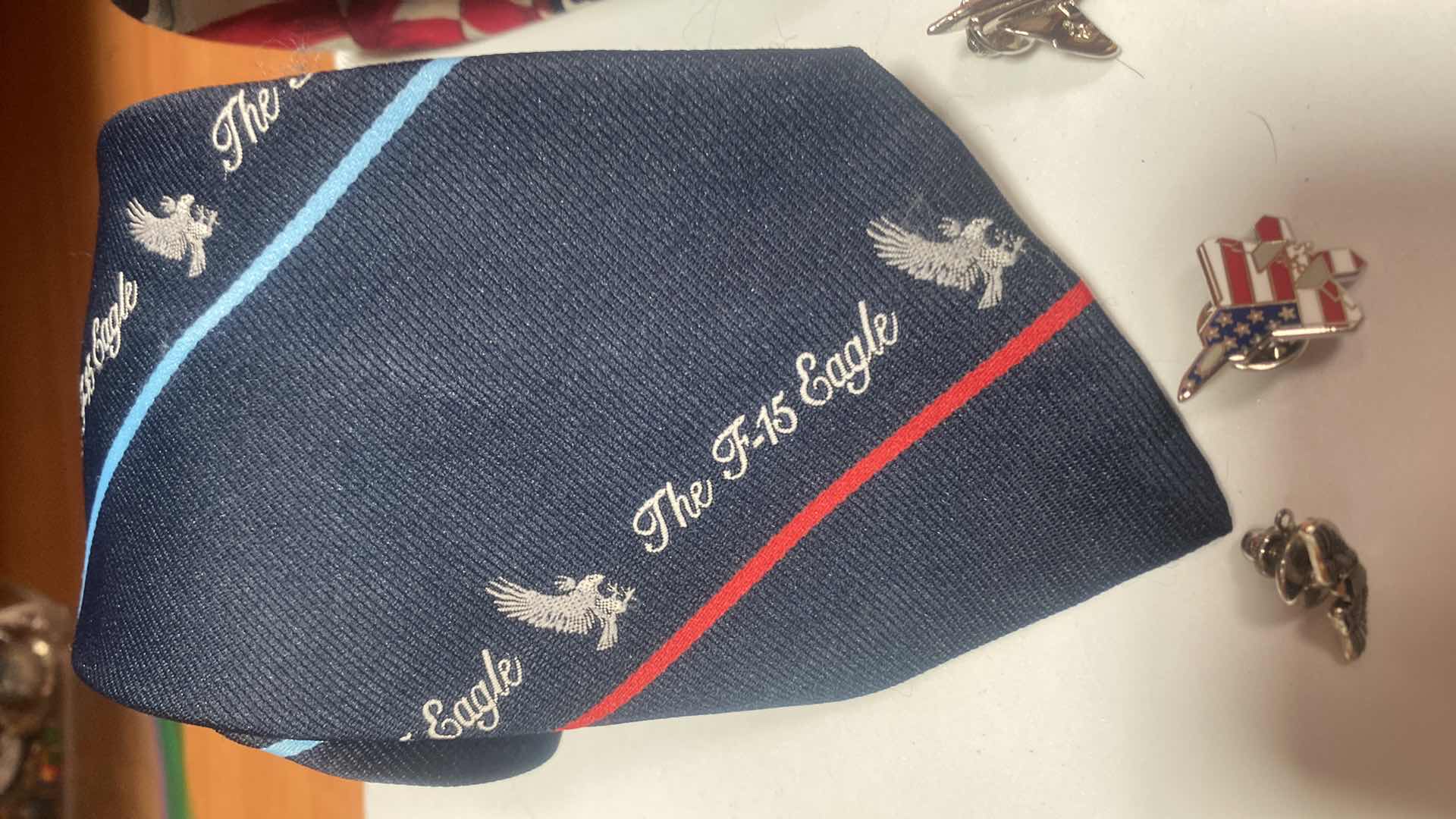 Photo 1 of MEN’S MILITARY TIE TACS & 2 PATRIOTIC TIES
