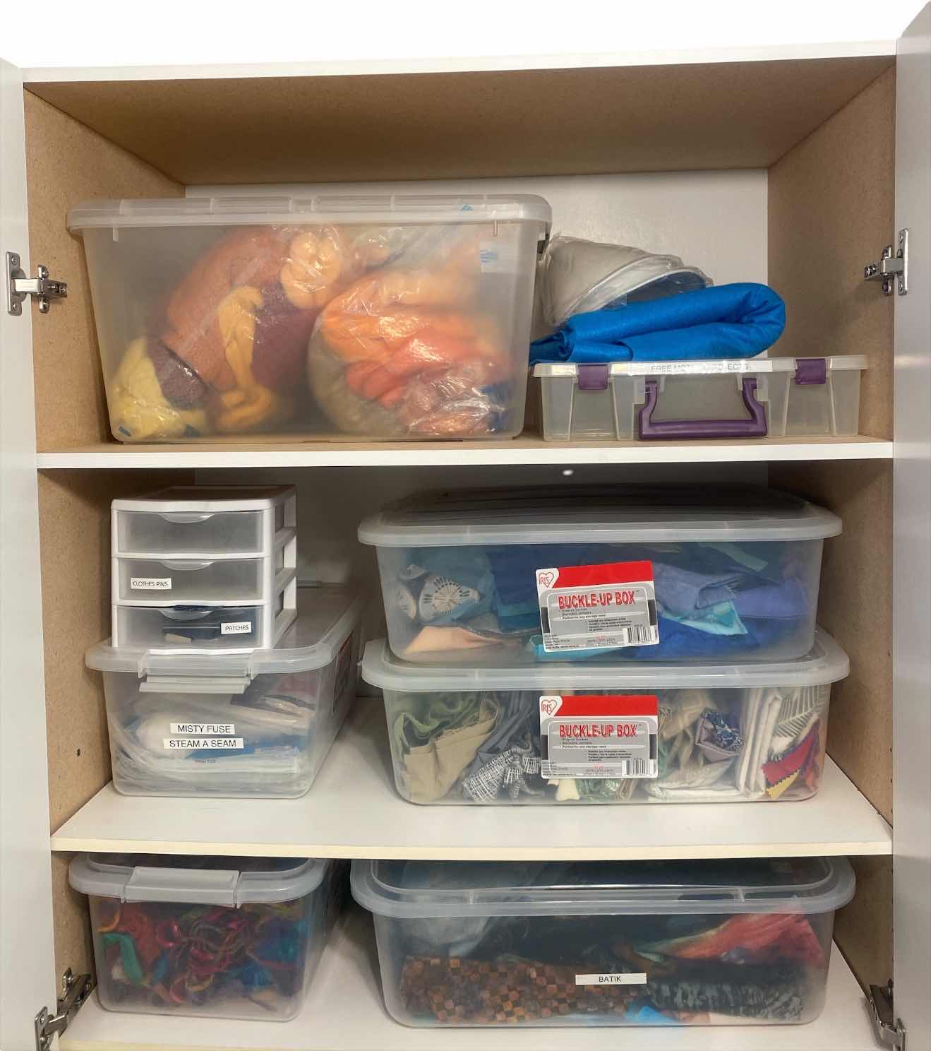 Photo 1 of CONTENTS OF CABINET THREE SHELVES OF CRAFTING SUPPLIES FABRIC AND YARN