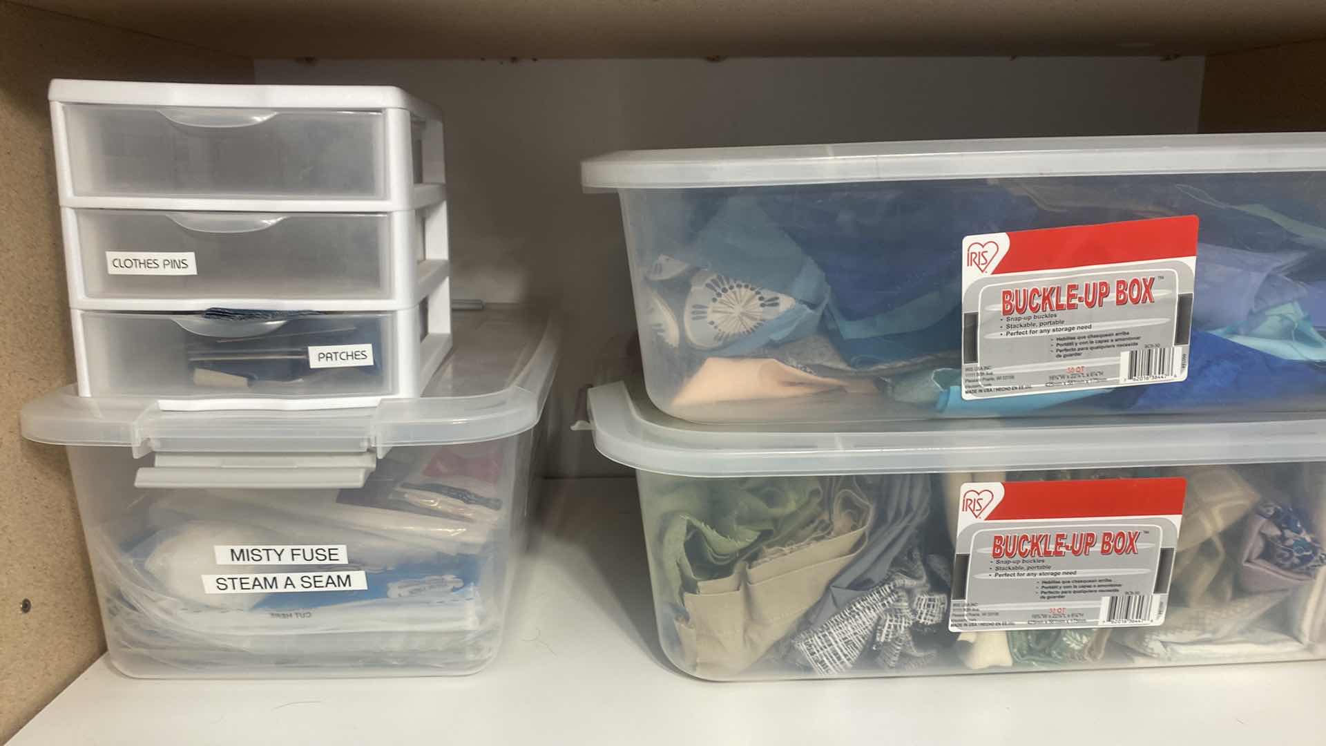Photo 1 of CONTENTS OF CABINET THREE SHELVES OF CRAFTING SUPPLIES FABRIC AND YARN