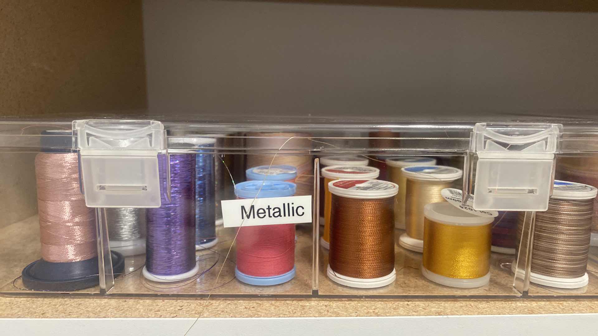 Photo 1 of CONTENTS OF CABINET TWO SHELVES WITH THREAD AND CRAFTING SUPPLIES