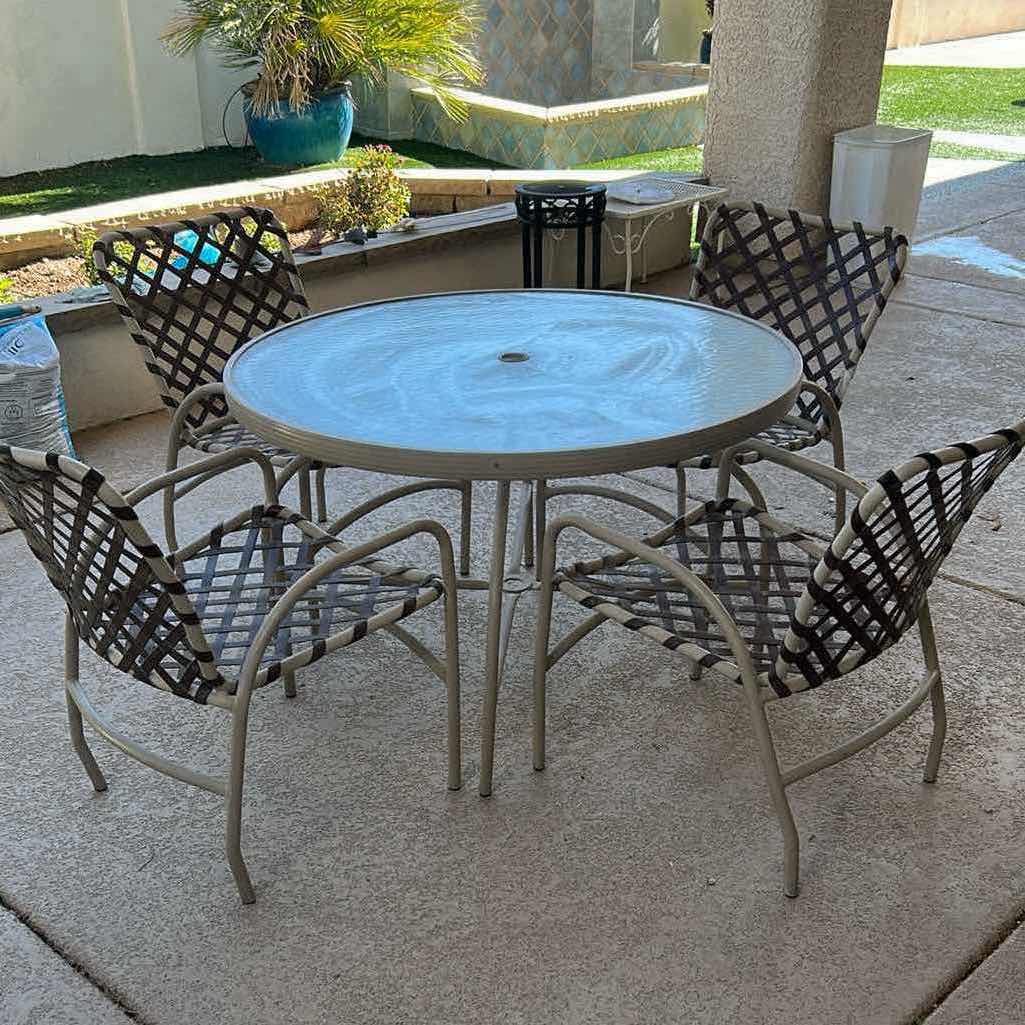 Photo 1 of GLASS TOP 40" PATIO TABLE W FOUR ARM CHAIRS W LATTICED VINYL STRAPS H 26"