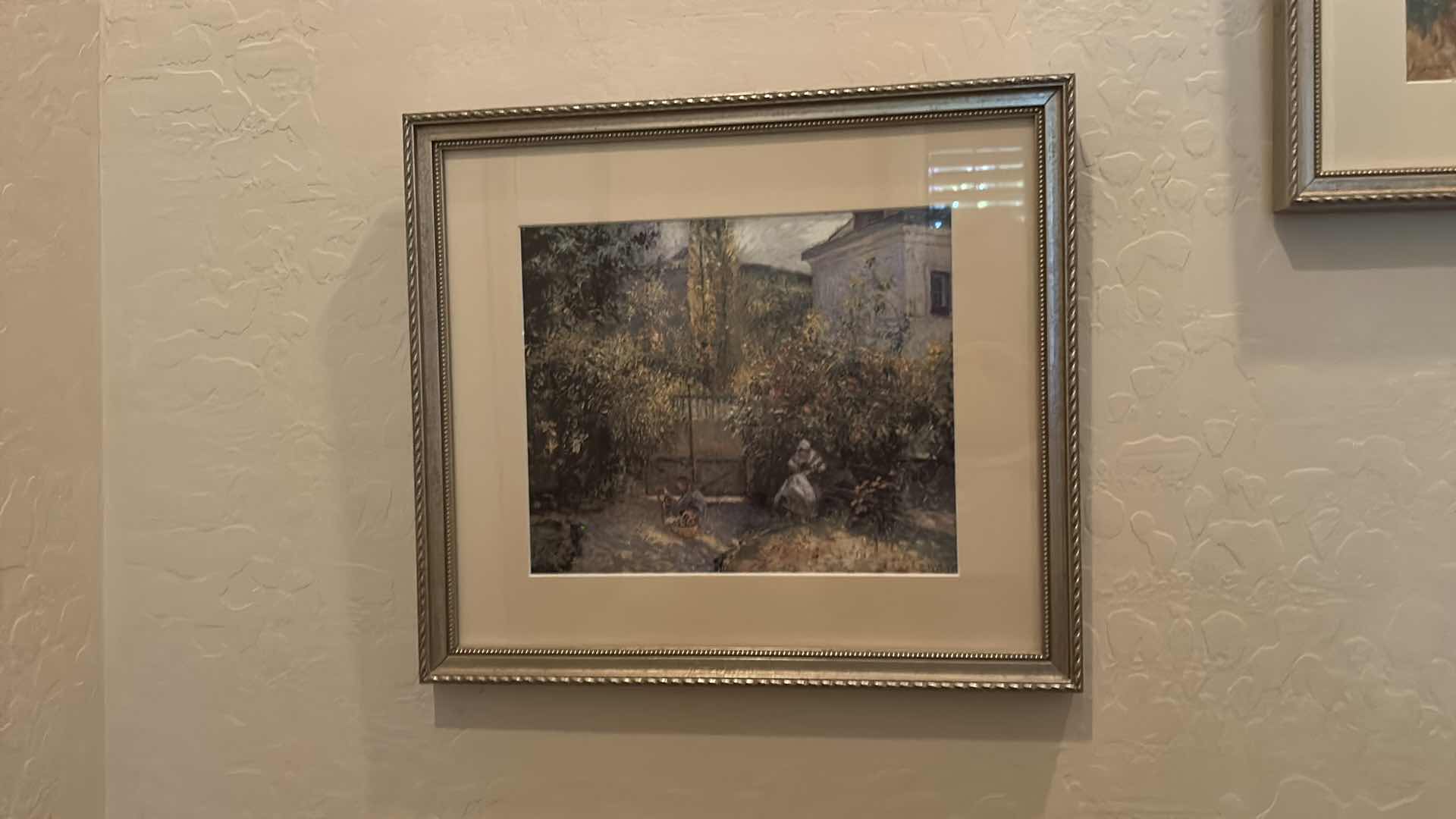 Photo 1 of FRAMED LANDSCAPE ART PRINT IN THE STYLE OF CLAUDE MONET’S “CAMILLE MONET IN THE GARDEN” ARTWORK 15 1/4” x H13 1/4”
