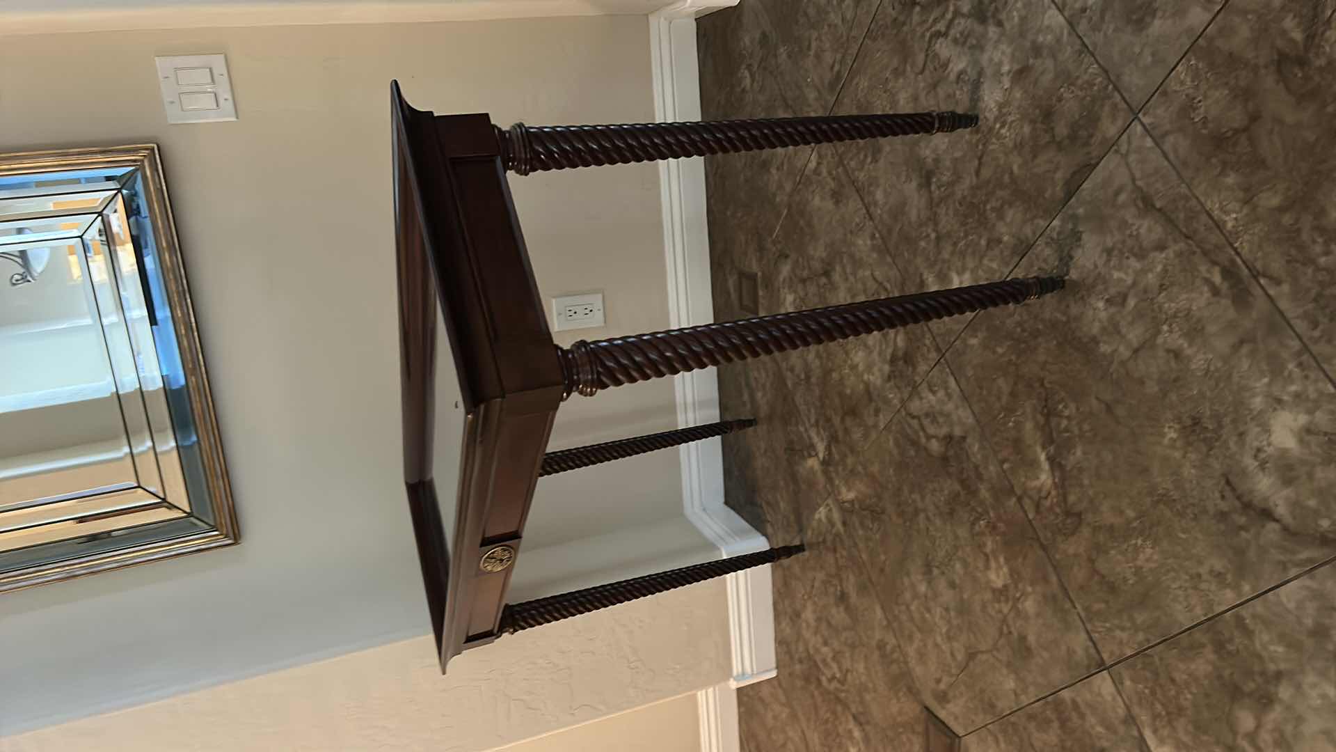 Photo 1 of DARK WOOD SOFA TABLE WITH GLASS TOP, TWISTED LEGS AND BRASS-TONE ACCENT PLAQUE 45“ x 17“ x H31 1/2“