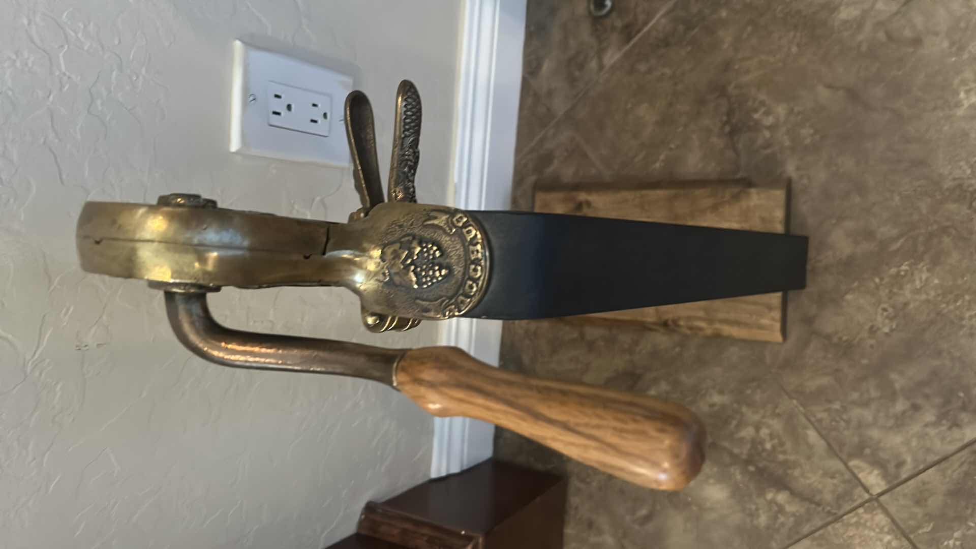 Photo 1 of VINTAGE BACCAUS TABLE TOP WINE BOTTLE OPENER MOUNTED ON ELEVATED WOOD H 23"