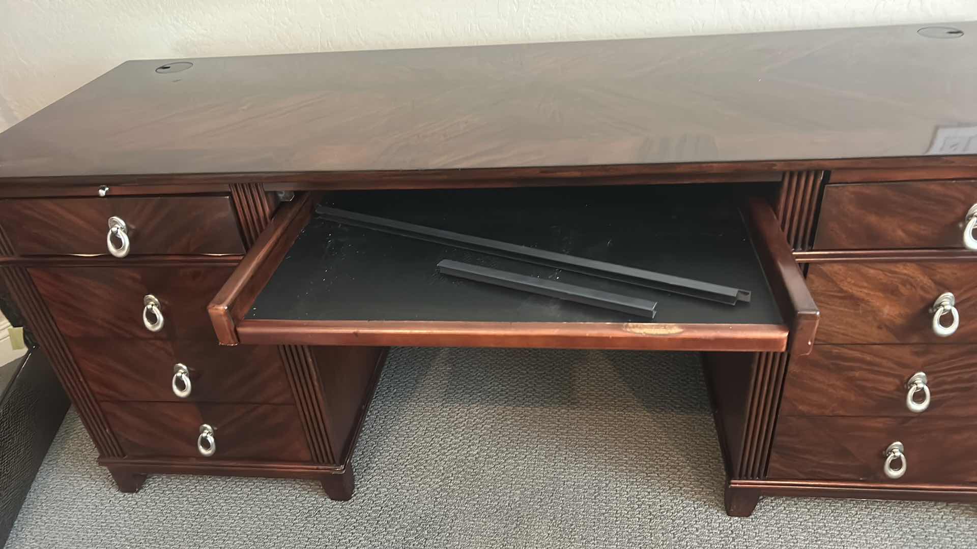 Photo 1 of WALNUT EXECUTIVE DESK WITH MATCHED VENEER, BRASS HARDWARE, KEYBOARD PULLOUT AND BUILT-IN ELECTRICAL PLUGS FOR COMPUTER EQUIPMENT 65” x 2‘ x H30“