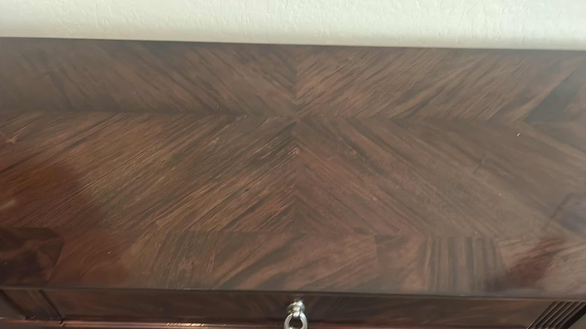 Photo 1 of WALNUT EXECUTIVE DESK WITH MATCHED VENEER, BRASS HARDWARE, KEYBOARD PULLOUT AND BUILT-IN ELECTRICAL PLUGS FOR COMPUTER EQUIPMENT 65” x 2‘ x H30“