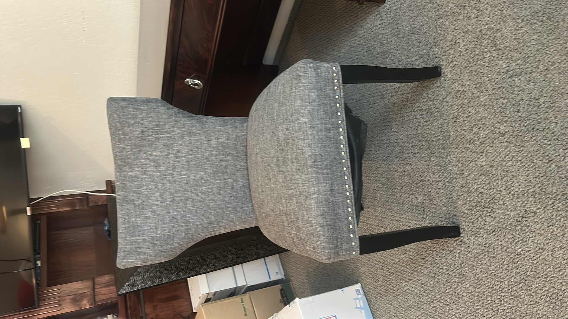 Photo 1 of GRAY UPHOLSTERED DINING CHAIR / DESK CHAIR WITH NAILHEAD TRIM AND BLACK LEGS 21 1/2” x 21” x H27 1/2”