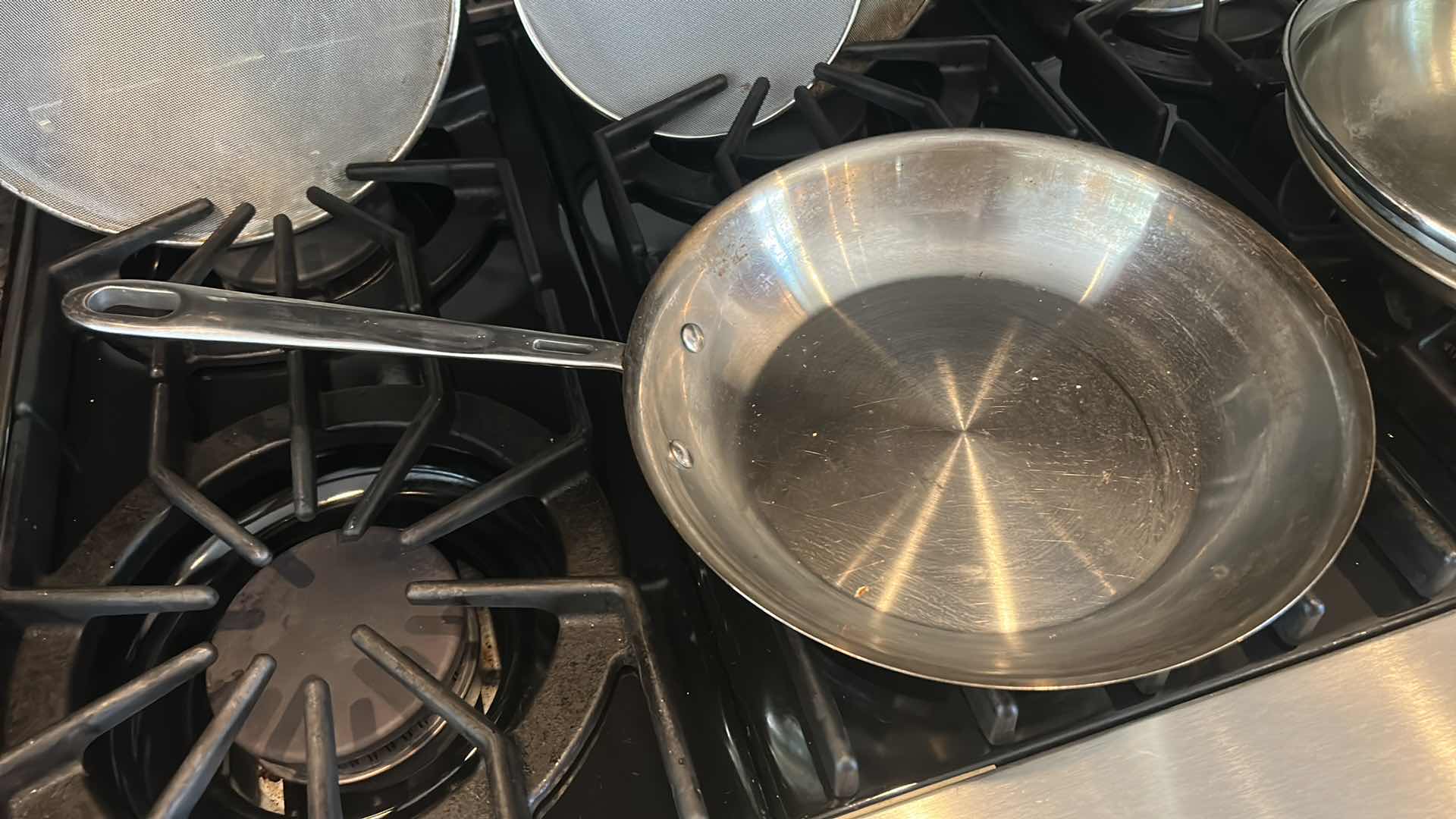Photo 1 of 3 EMERIL SKILLETS AND 4 OIL SPATTER COVERS