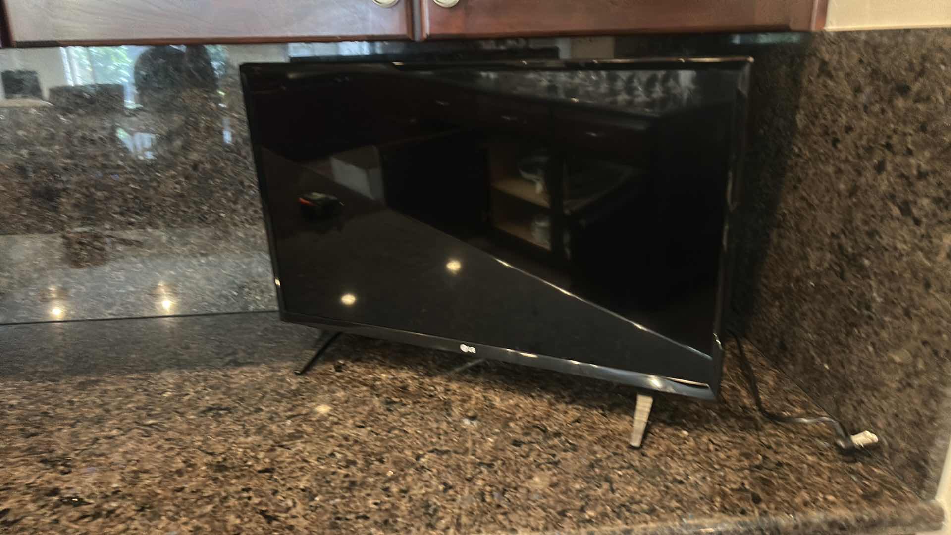Photo 1 of LG 28” FREESTANDING TV