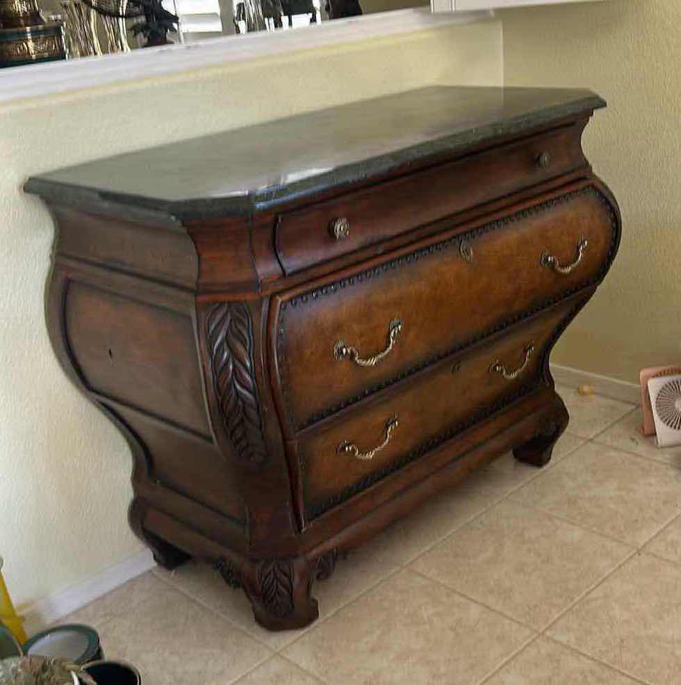 Photo 1 of THIS VINTAGE-STYLE BOMBAY CHEST FEATURES A DISTINCTIVE CURVED SILHOUETTE AND A DARK MARBLE TOP. 44“ x 22“ x H33 1/2“. $1500
