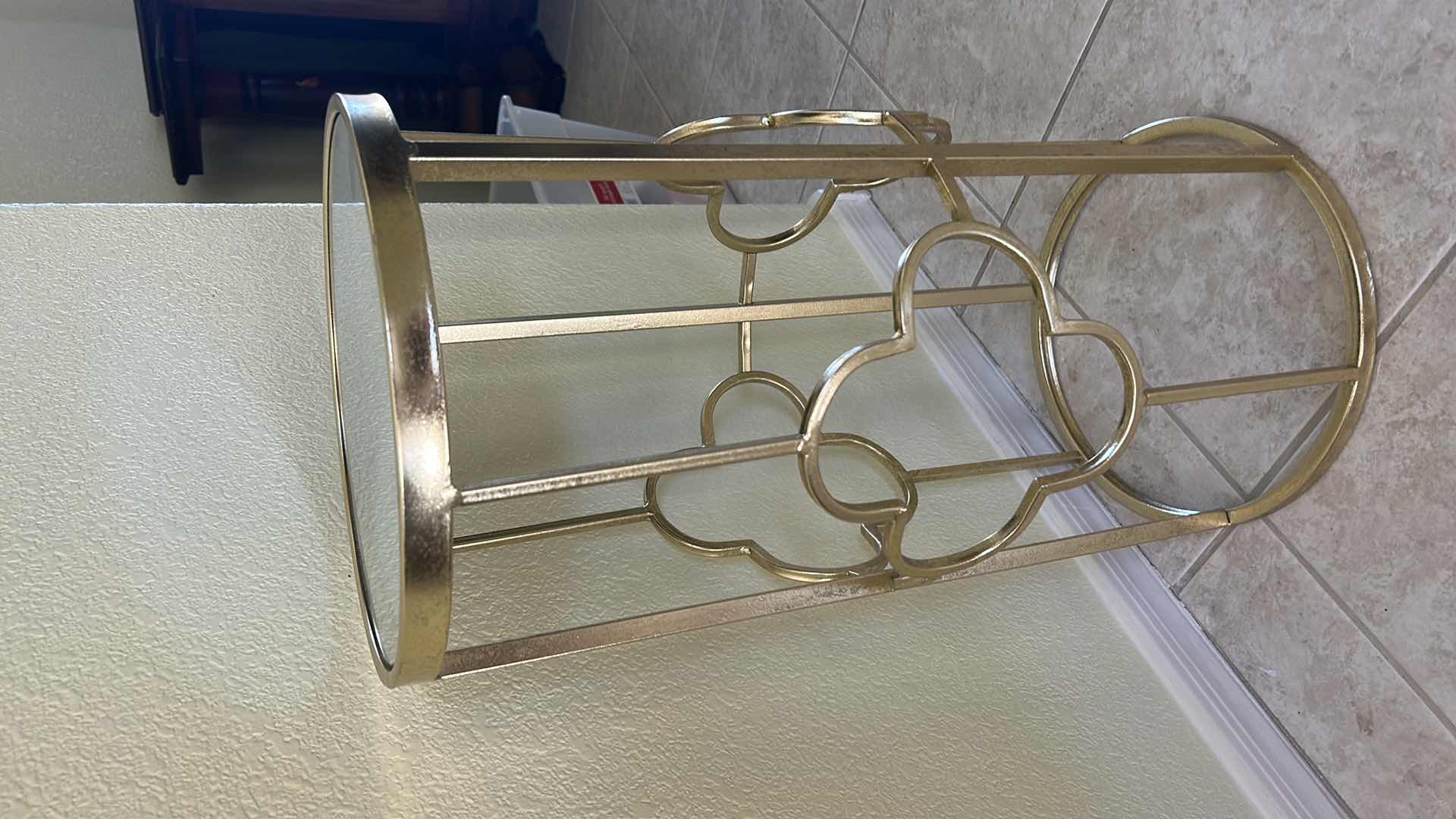 Photo 1 of GOLD METAL SIDE TABLE FROM GRAYSON LANE FEATURING A MIRRORED GLASS TOP AND A CLOVER-SHAPED OPEN FRAME. 12” x H22 1/2”.