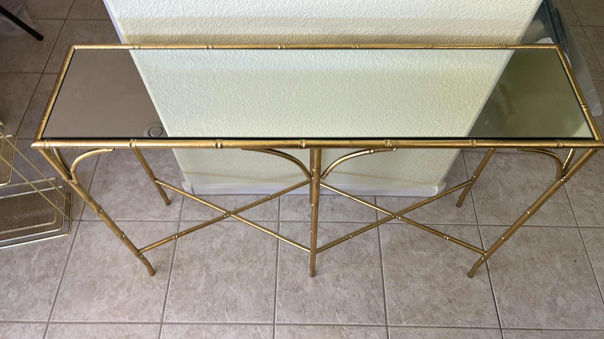 Photo 1 of VINTAGE GOLD BAMBOO-STYLE CONSOLE TABLE FEATURING A GLASS TOP AND AN ELEGANT GOLD-FINISHED METAL FRAME DESIGNED TO RESEMBLE BAMBOO 40“ x 10 1/2“ x H29“.