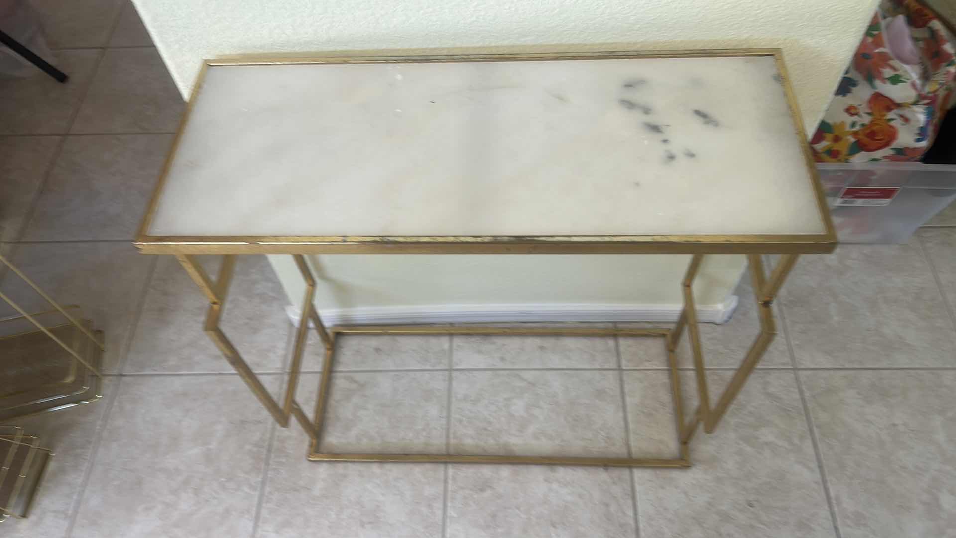 Photo 1 of GOLD METAL CONSOLE TABLE FEATURING A WHITE MARBLE TOP AND AN OPEN GEOMETRIC FRAME 27 1/2“ x 11“ x 28“