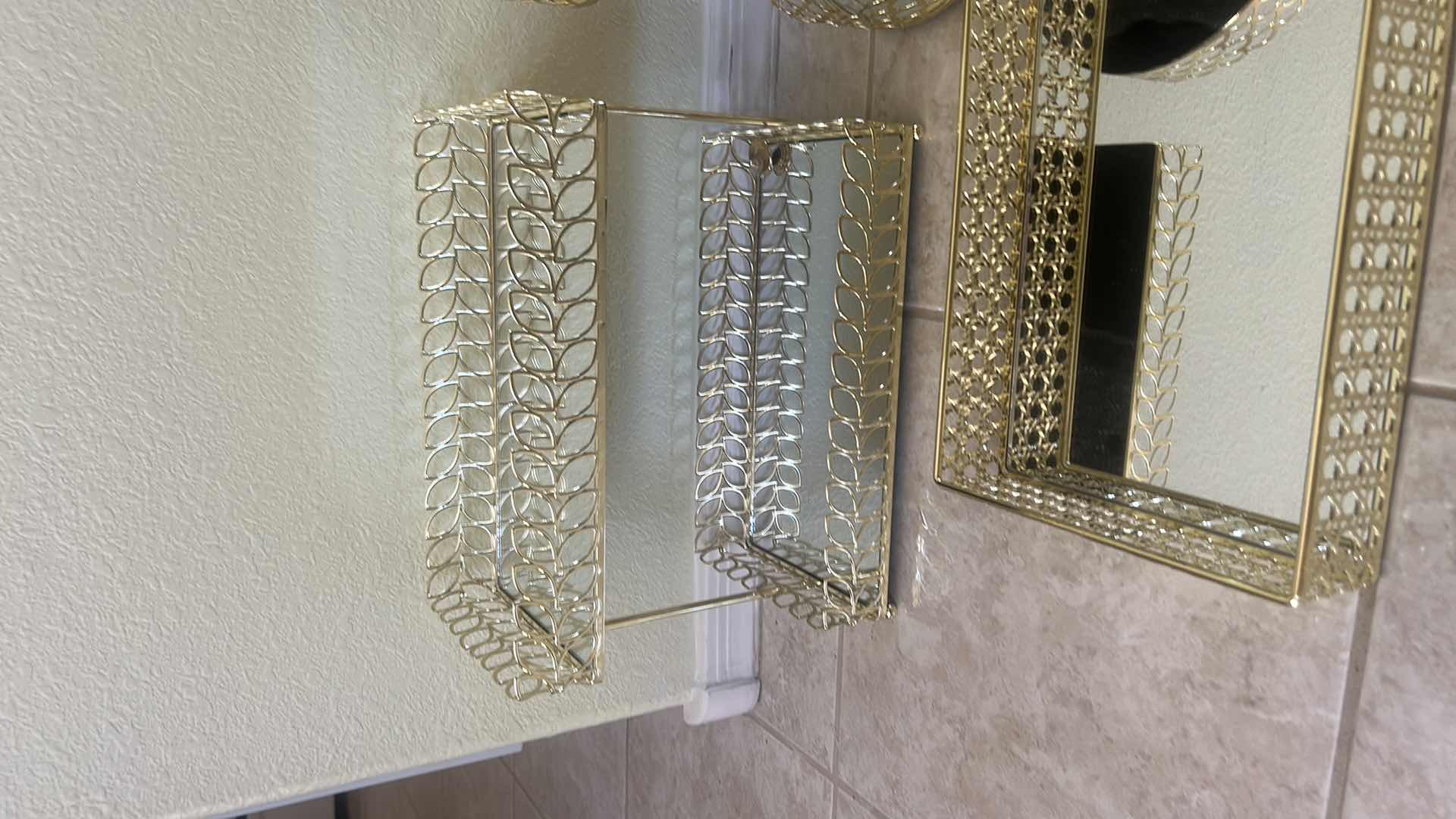 Photo 1 of SET OF GOLD METAL VANITY ORGANIZERS FEATURING MIRRORED TRAYS,