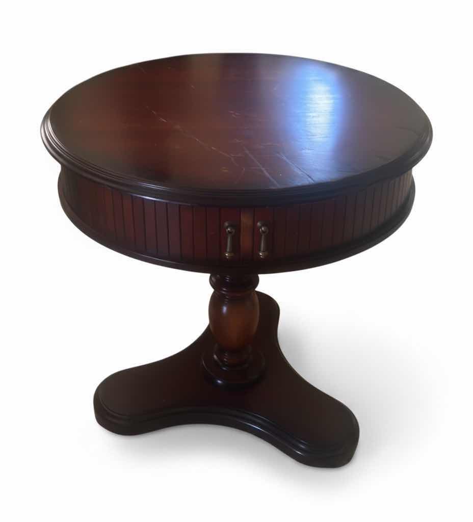 Photo 1 of BUTLER SPECIALTY COMPANY ELLSWORTH FOYER TABLE FEATURING A ROUND TOP, RIBBED CYLINDRICAL CABINET BASE, AND INTERIOR STORAGE COMPARTMENT. 29 1/4“ x 29 1/2“.