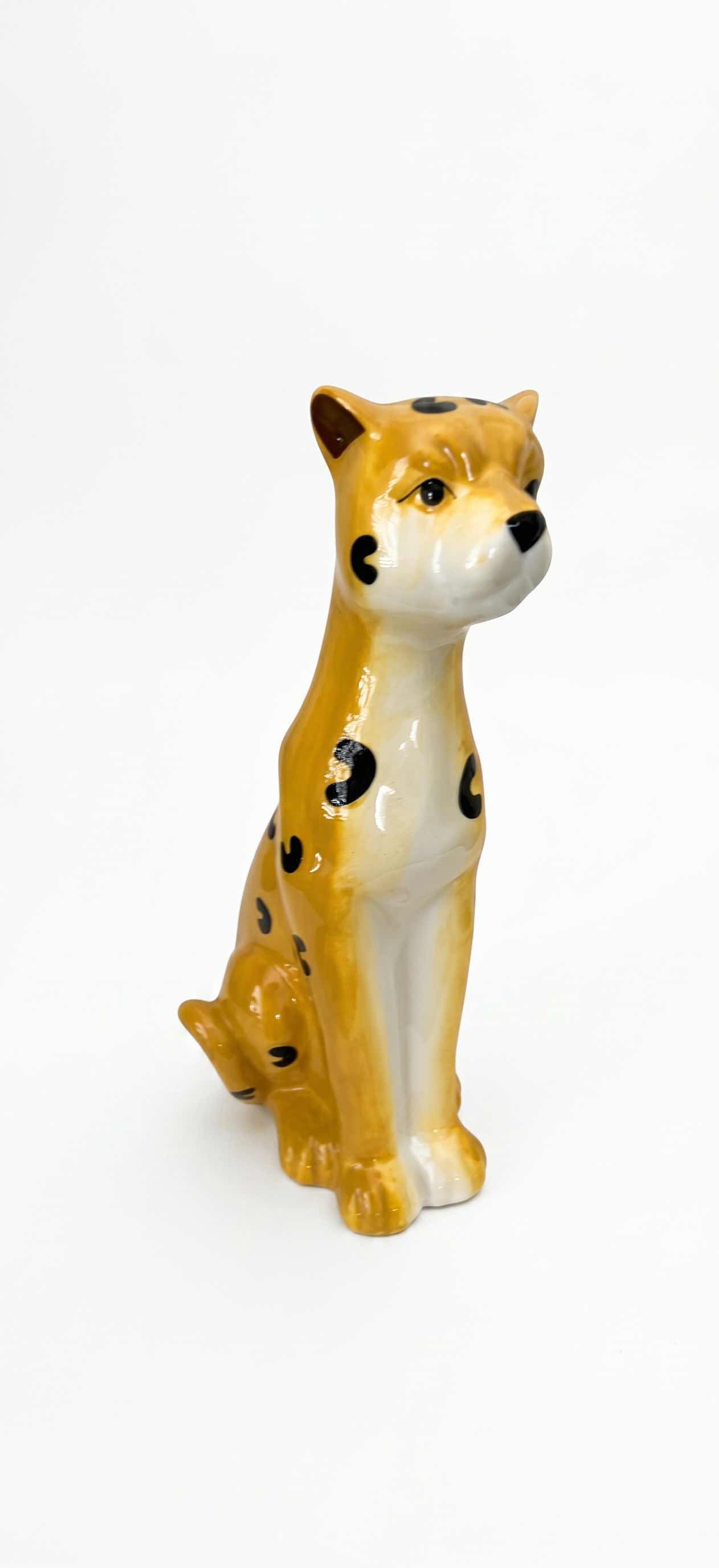 Photo 1 of CERAMIC CHEETAH FIGURINE FEATURES HAND-PAINTED DETAILS AND A GLOSSY FINISH. H13”