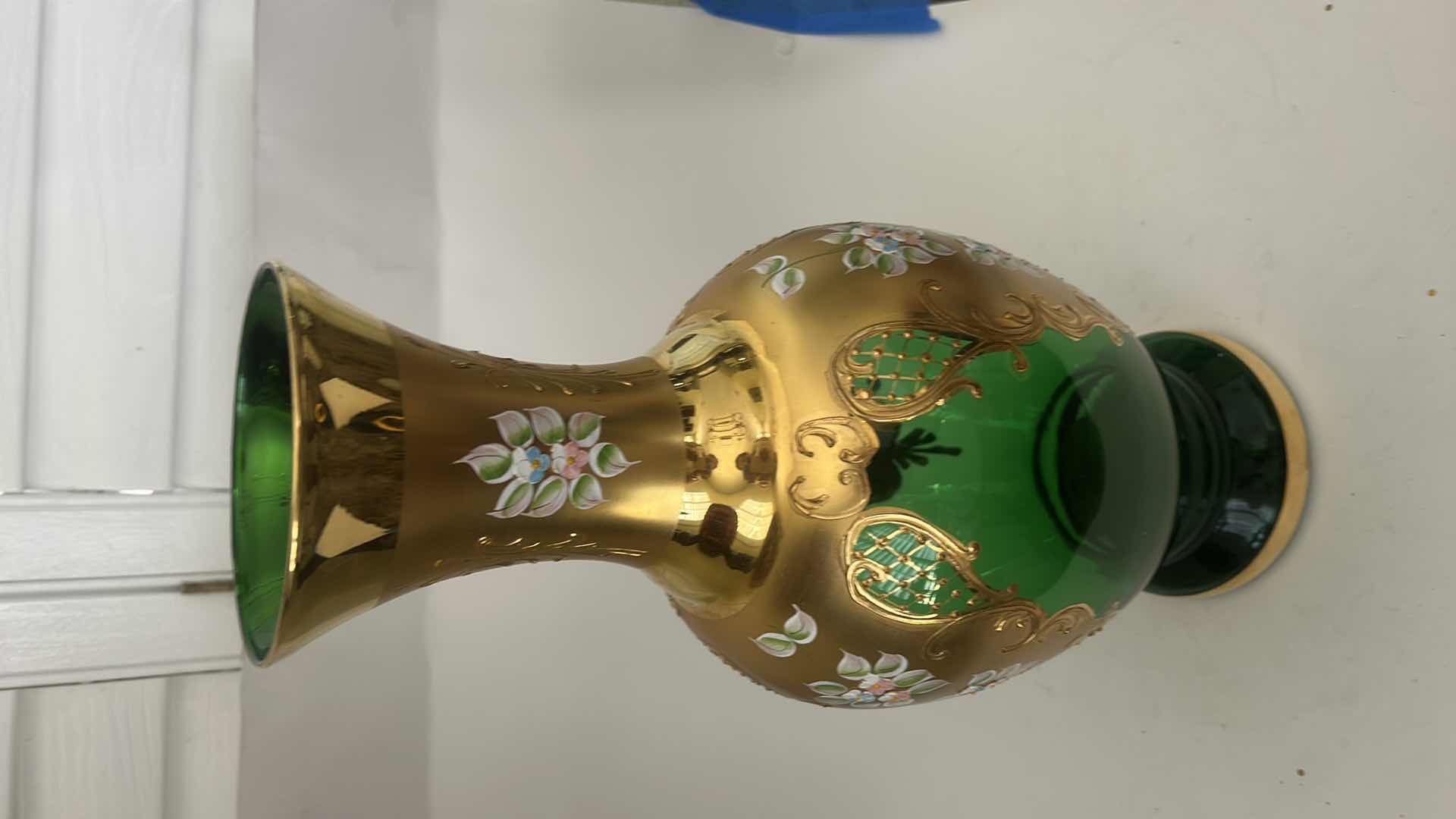 Photo 1 of BOHEMIAN ART GLASS VASE FEATURES A VIBRANT GREEN BODY ADORNED WITH INTRICATE GOLD GILDING & HAND-PAINTED FLORAL ENAMEL DETAILS H16.5”