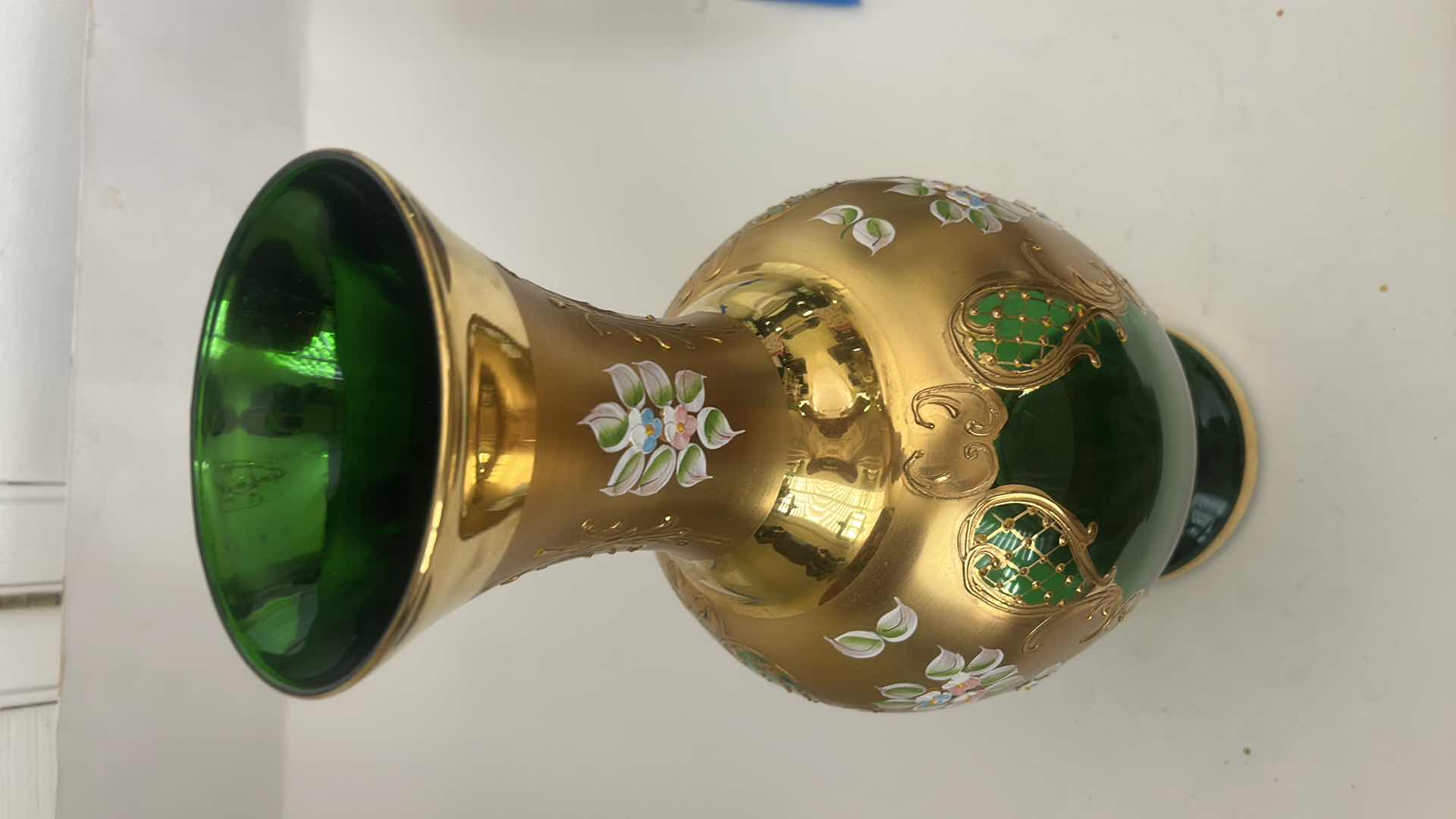 Photo 1 of BOHEMIAN ART GLASS VASE FEATURES A VIBRANT GREEN BODY ADORNED WITH INTRICATE GOLD GILDING & HAND-PAINTED FLORAL ENAMEL DETAILS H16.5”