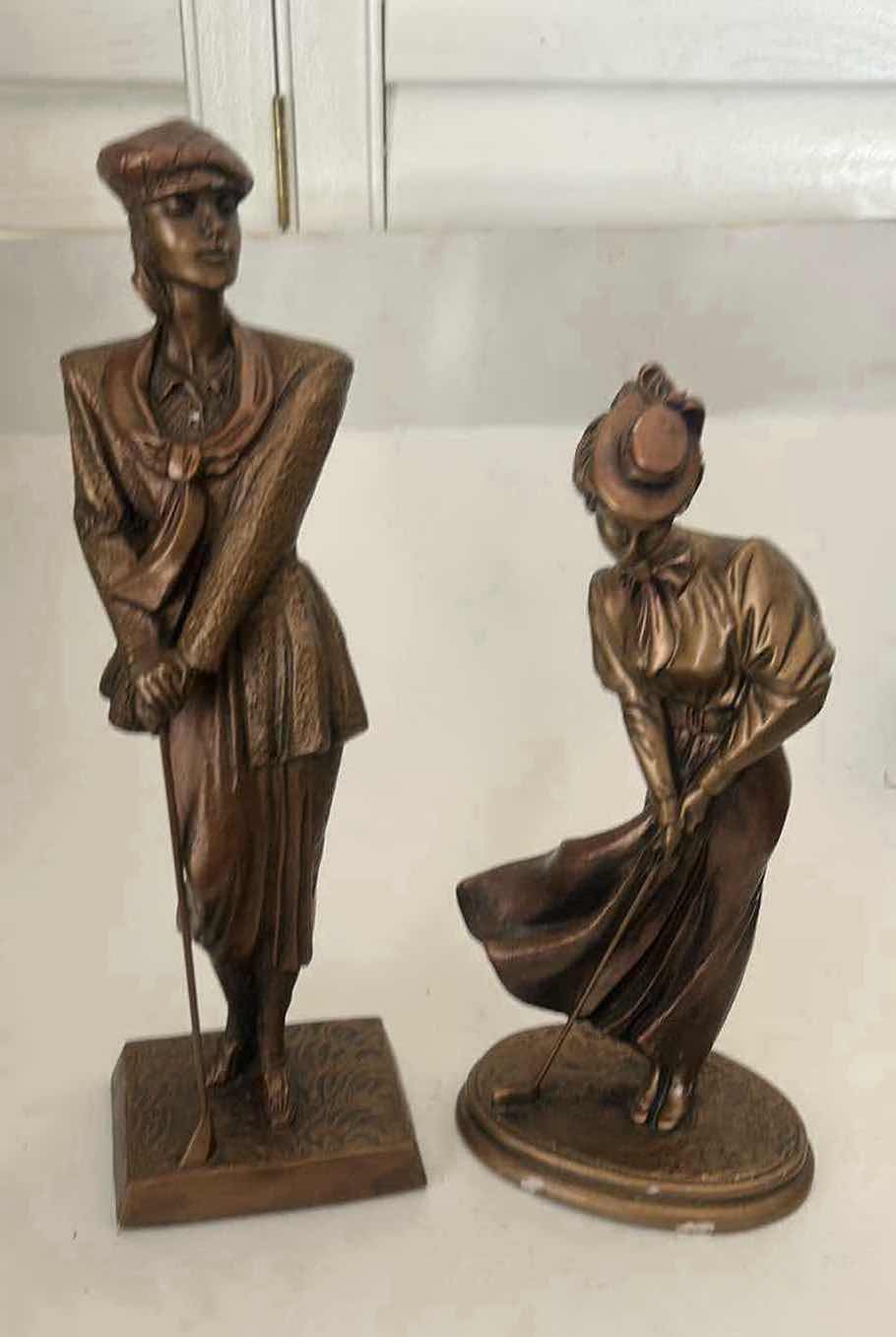 Photo 1 of 2 - AUSTIN PRODUCTIONS GOLFER STATUES, FEATURING A BRONZED FINISH ON A DURABLE RESIN MATERIAL. (TALLEST H 16.25”)