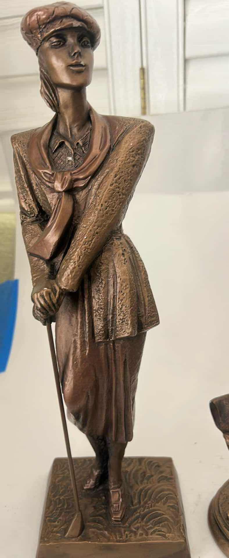 Photo 1 of 2 - AUSTIN PRODUCTIONS GOLFER STATUES, FEATURING A BRONZED FINISH ON A DURABLE RESIN MATERIAL. (TALLEST H 16.25”)
