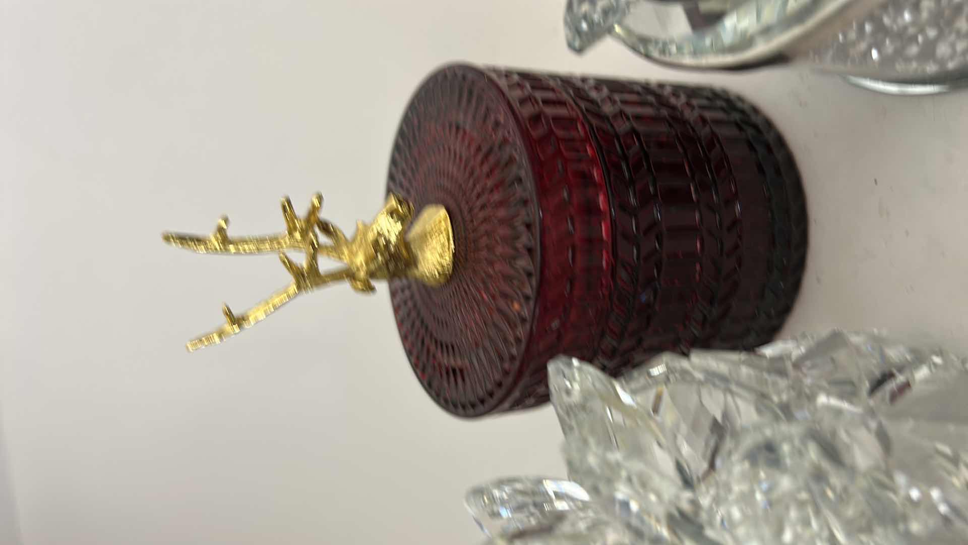Photo 1 of SAGEBROOK HOME DECORATIVE BOXES FEATURE CRYSTAL LOTUS FLOWER LIDS AND GLITTER-FILLED OR FACETED GLASS BODIES FOR STORING SMALL TREASURES & RUBY-COLORED LVD GLASS TRINKET BOX FEATURES A DISTINCTIVE GOLD REINDEER TOPPER. $125