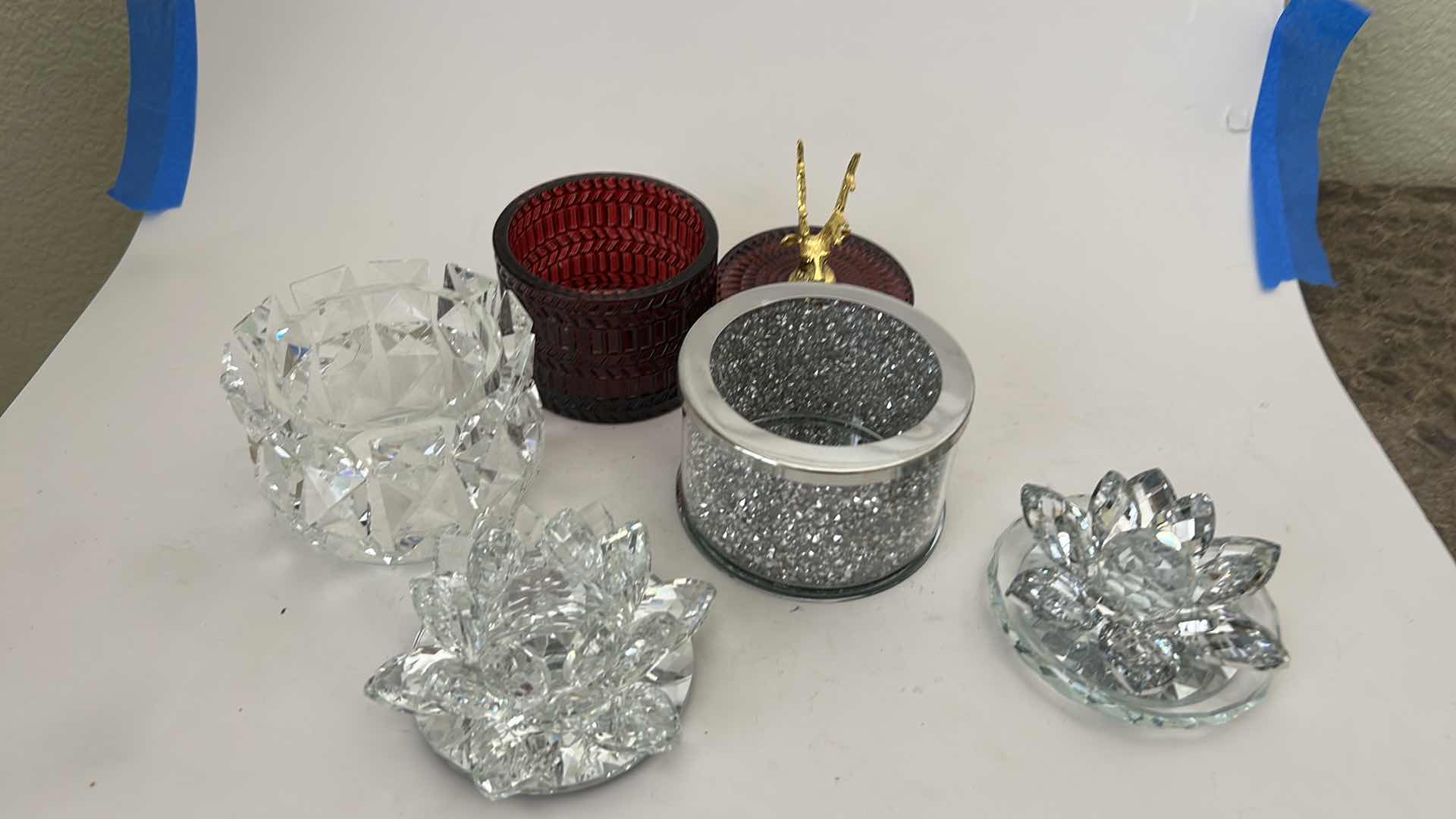 Photo 1 of SAGEBROOK HOME DECORATIVE BOXES FEATURE CRYSTAL LOTUS FLOWER LIDS AND GLITTER-FILLED OR FACETED GLASS BODIES FOR STORING SMALL TREASURES & RUBY-COLORED LVD GLASS TRINKET BOX FEATURES A DISTINCTIVE GOLD REINDEER TOPPER. $125