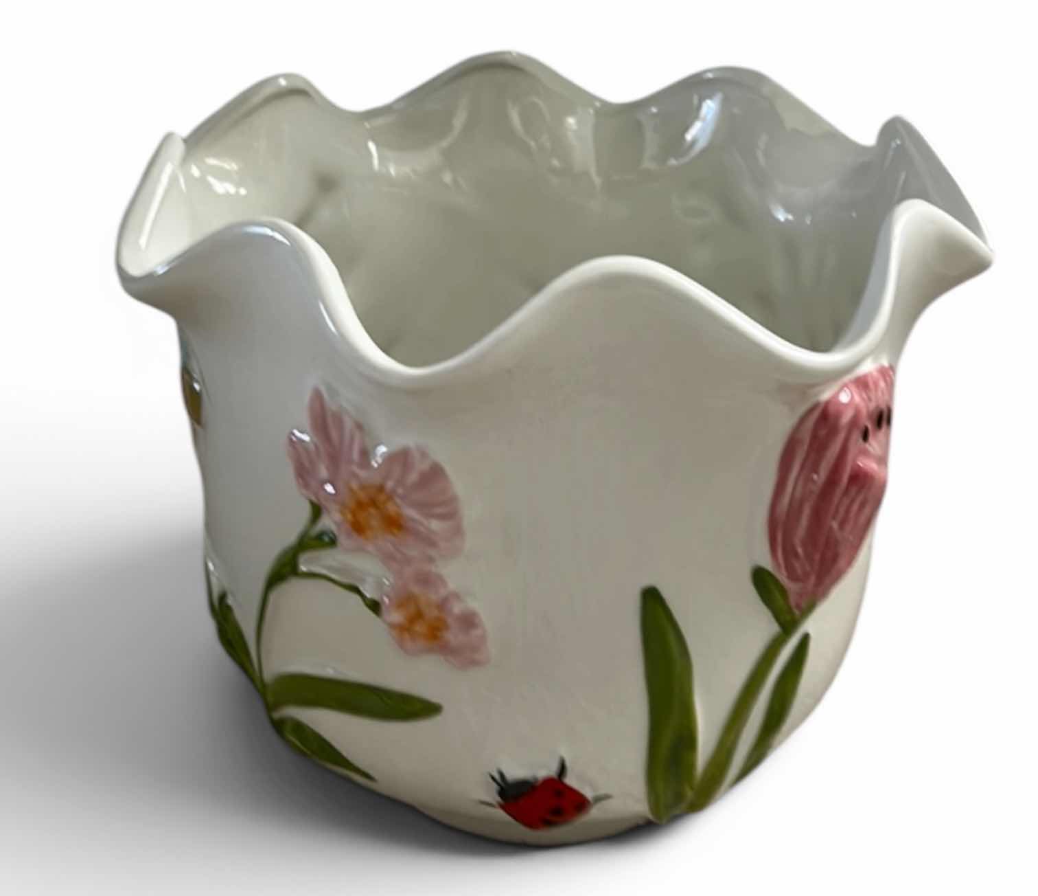 Photo 1 of WHITE CERAMIC PLANTER ARTWARE FEATURING A COLORFUL, HAND-PAINTED BUTTERFLY AND FLORAL DESIGN.
10” x H9”