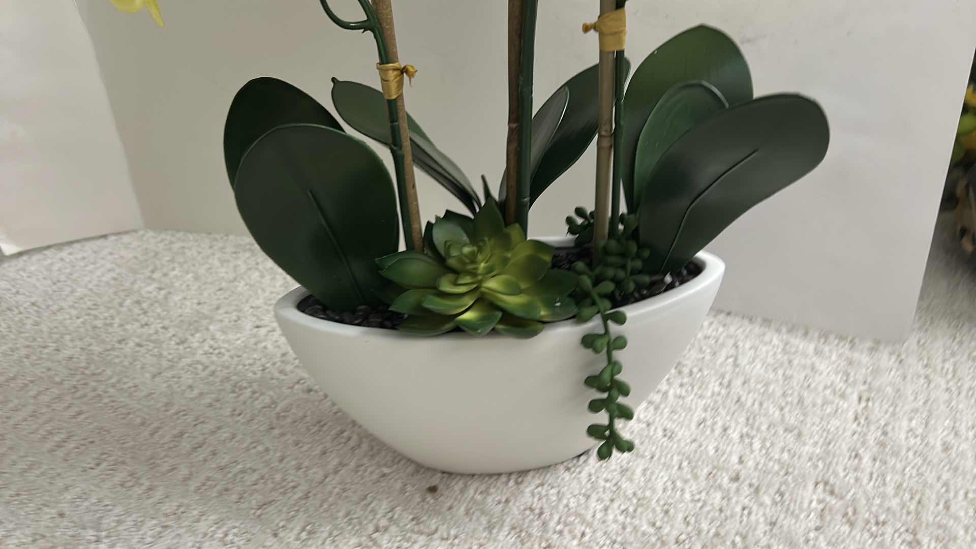 Photo 1 of ARTIFICIAL PHALAENOPSIS ORCHID ARRANGEMENT FEATURES VIBRANT YELLOW FLOWERS SET IN A SLEEK WHITE CERAMIC POT H24”