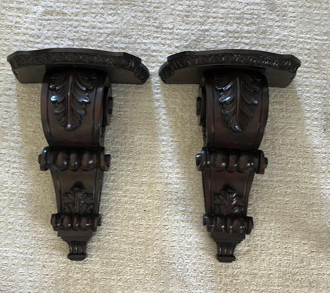 Photo 1 of 2 -MAHOGANY SCONCE CORBELS FEATURE INTRICATE ACANTHUS LEAF CARVINGS AND A RICH, DARK WOOD FINISH. H16” $100