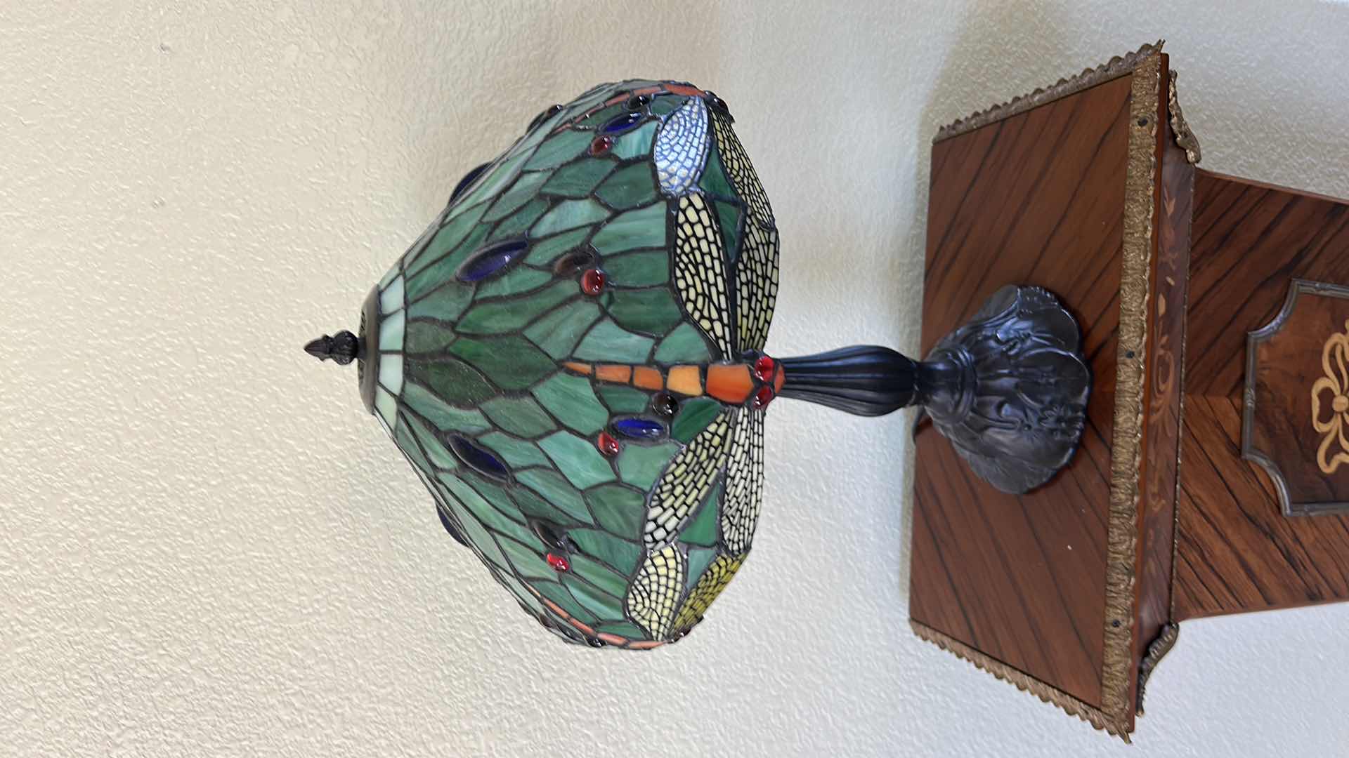 Photo 1 of DRAGONFLY TABLE LAMP FEATURES A GREEN STAINED GLASS SHADE WITH RED AND BLUE JEWELED INSERTS, RESEMBLING STYLES OFFERED BY WAREHOUSE OF TIFFANY. H19”