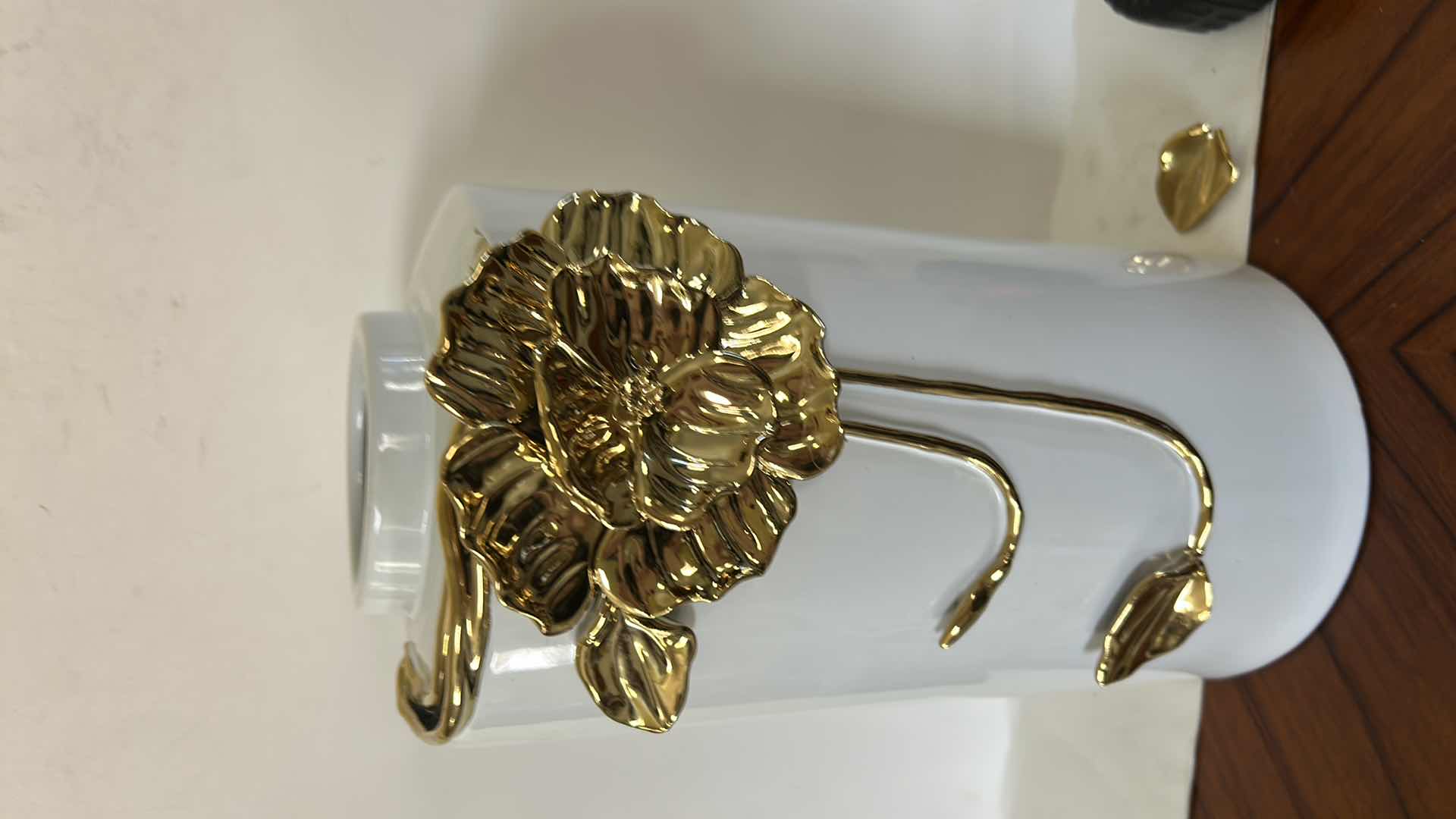 Photo 1 of CERAMIC VASE FEATURES A LARGE, SCULPTURAL GOLD FLOWER DETAIL. H12”
