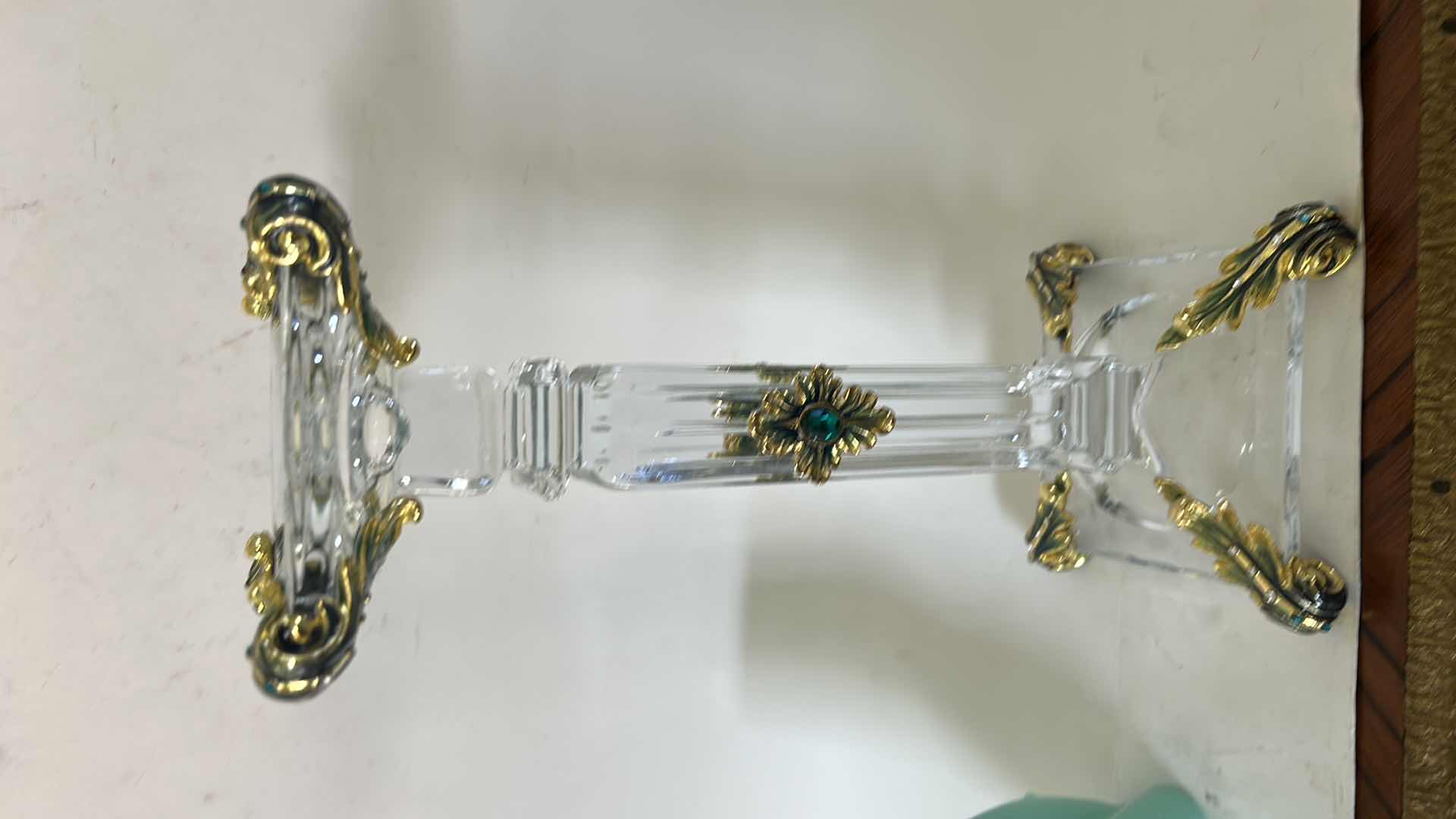 Photo 1 of ORNATE BAROQUE-STYLE CRYSTAL CANDLESTICK FEATURES DISTINCTIVE GOLD-LEAF EMBELLISHMENTS AND EMERALD-COLORED JEWEL ACCENTS. H13” & BATTERY OPERATED CANDLE.