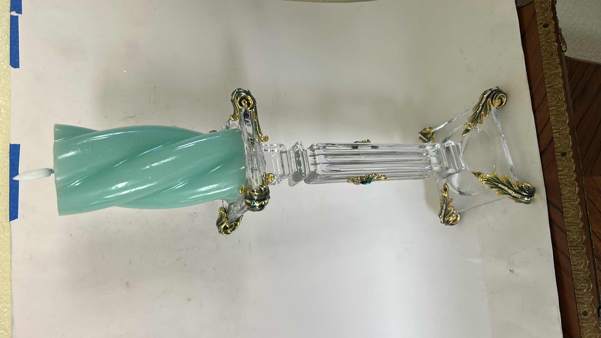 Photo 1 of ORNATE BAROQUE-STYLE CRYSTAL CANDLESTICK FEATURES DISTINCTIVE GOLD-LEAF EMBELLISHMENTS AND EMERALD-COLORED JEWEL ACCENTS. H13” & BATTERY OPERATED CANDLE. $125