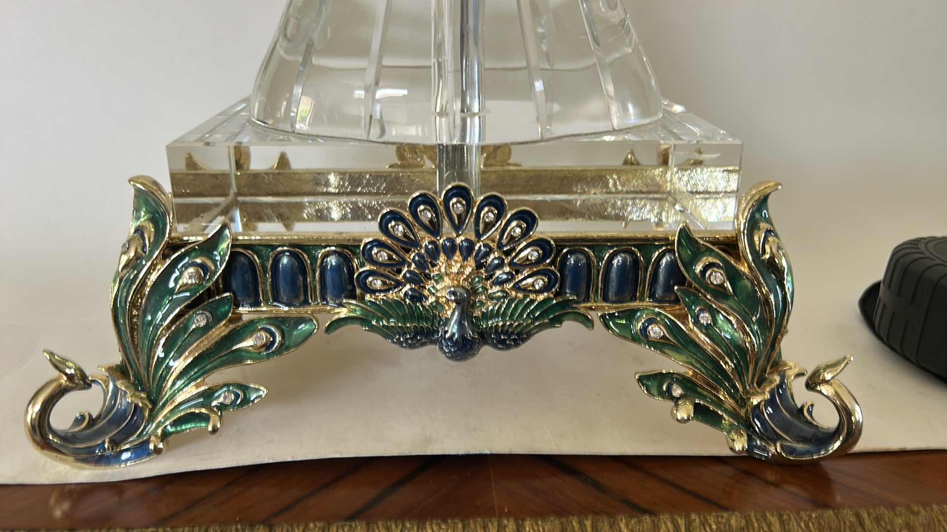 Photo 1 of REGIS GALERIE PEACOCK CRYSTAL CLOCK FEATURES AN ORNATE, ENAMELED PEACOCK FIGURE PERCHED ATOP A CLEAR CRYSTAL STAND H 24”