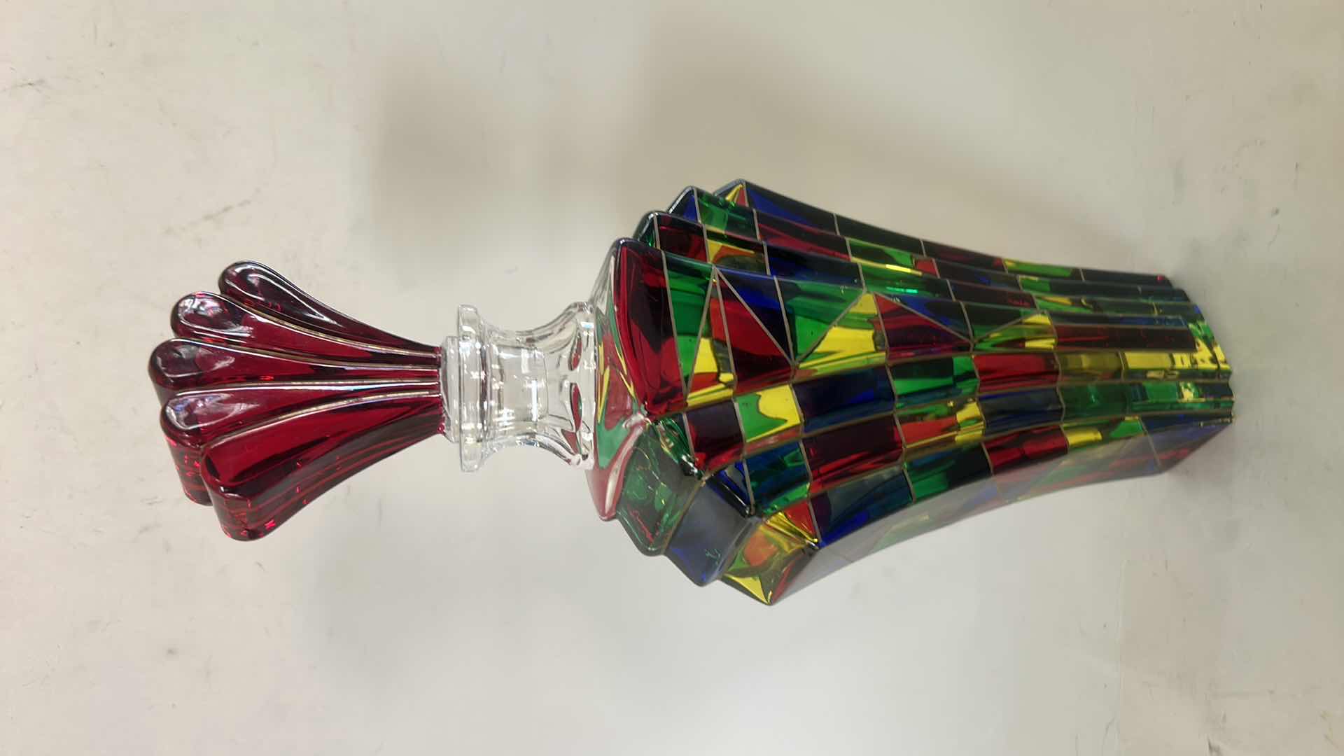 Photo 1 of DECORATIVE ART GLASS DECANTER RESEMBLES THE “SCALENO” DESIGN CREATED BY LUIGI BORMIOLI IN ITALY DURING THE 1970S. THE PIECE FEATURES A VIBRANT GEOMETRIC MOSAIC PATTERN AND A DISTINCTIVE FAN-SHAPED STOPPER H12”
