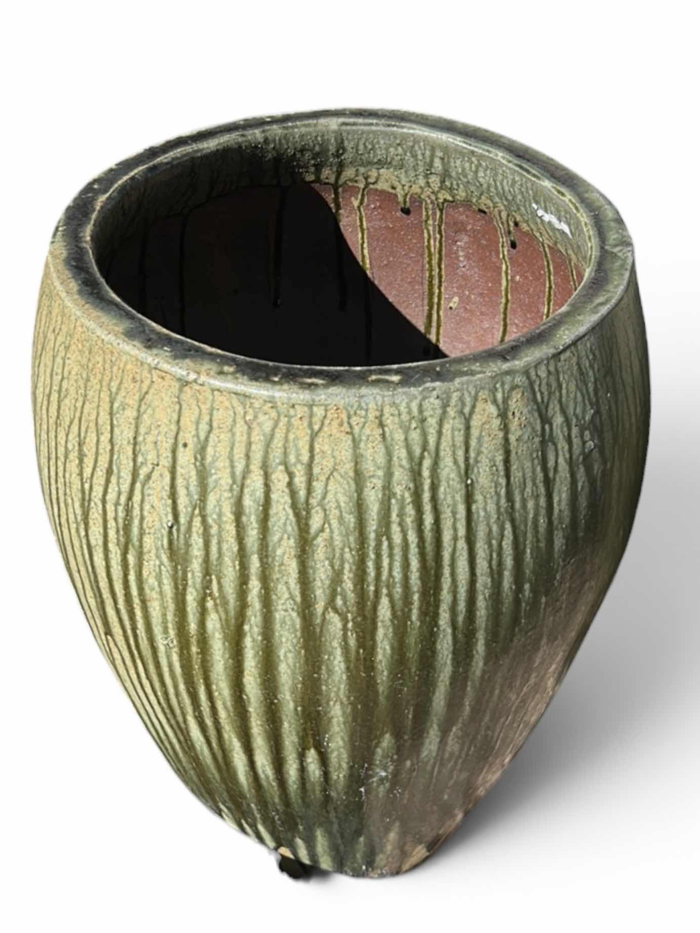 View 1 of ANTIQUE DRIP PLANTER FEATURES A YELLOW-GREEN FINISH WITH A RUSTIC DRIP DESIGN. H23” $600