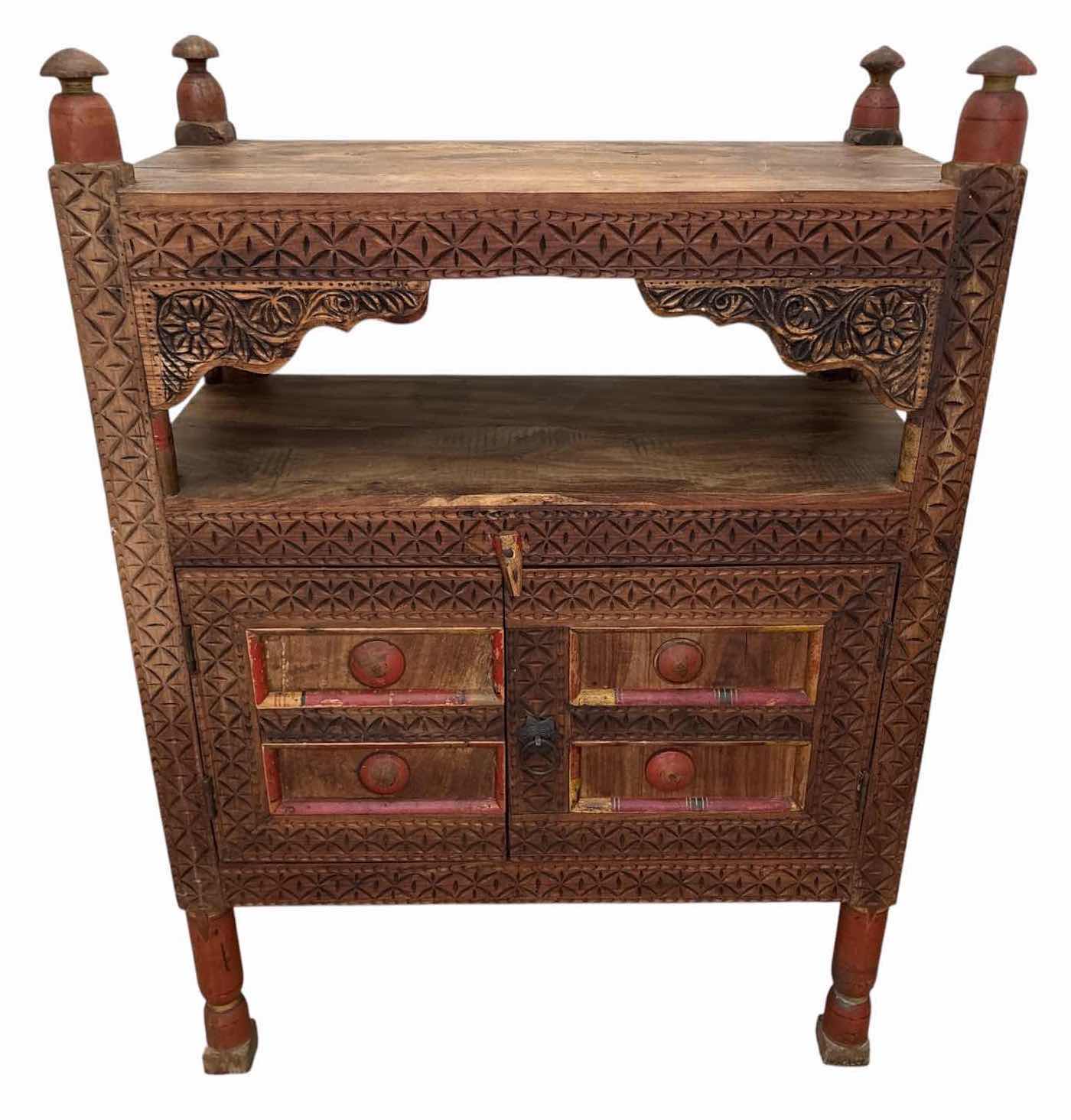 Photo 1 of HAND-CARVED WOOD ACCENT CABINET W/OPEN SHELF, TWO DOORS, INTERIOR STORAGE, AND DISTRESSED PAINTED ACCENTS 32”X16.5”H45”