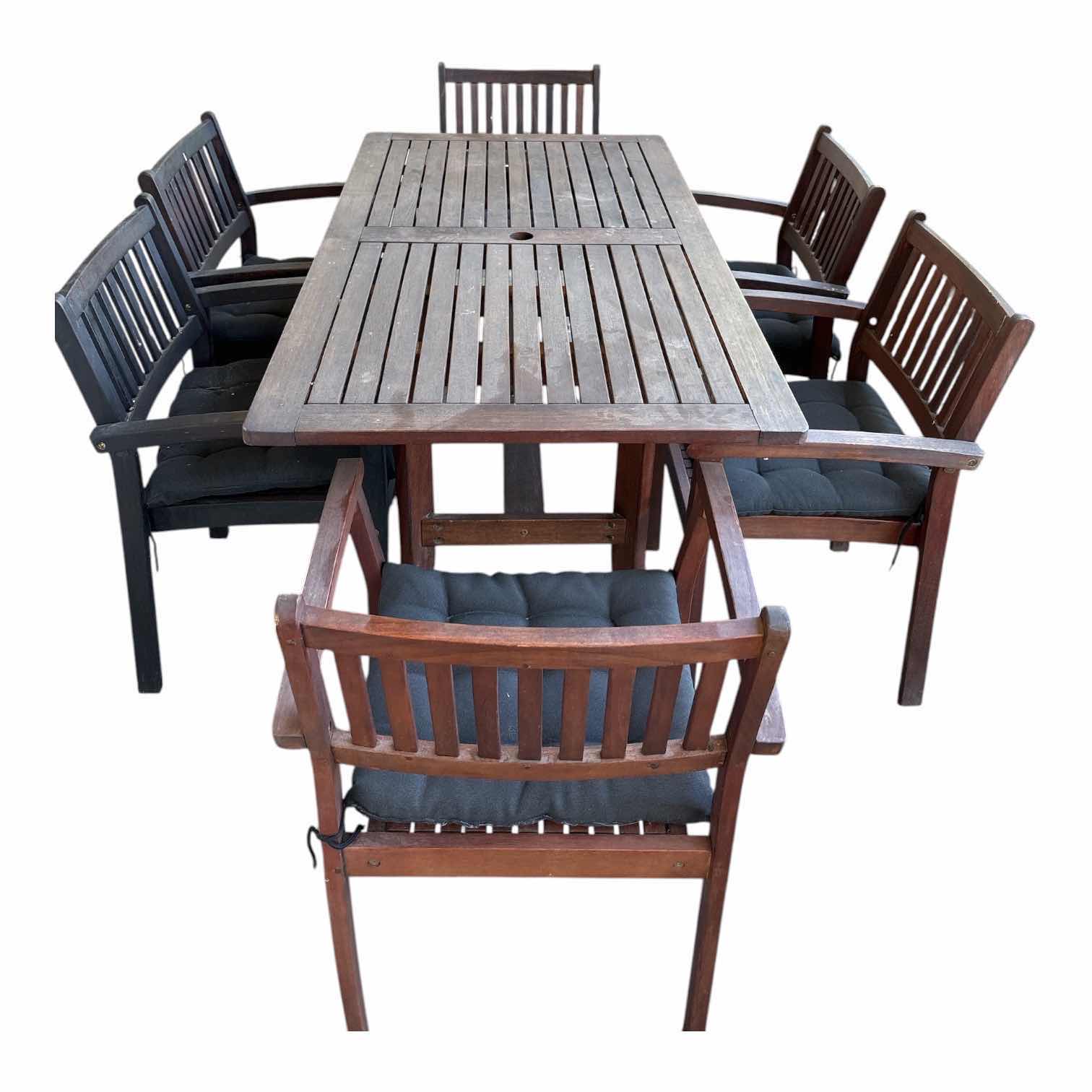 Photo 1 of (7)PCS HARDWOOD OUTDOOR PATIO DINING SET WITH RECTANGULAR SLAT-TOP TABLE, (6) ARMCHAIRS, UMBRELLA HOLE, AND BLACK SEAT CUSHIONS TABLE 59”X31.5”H30”