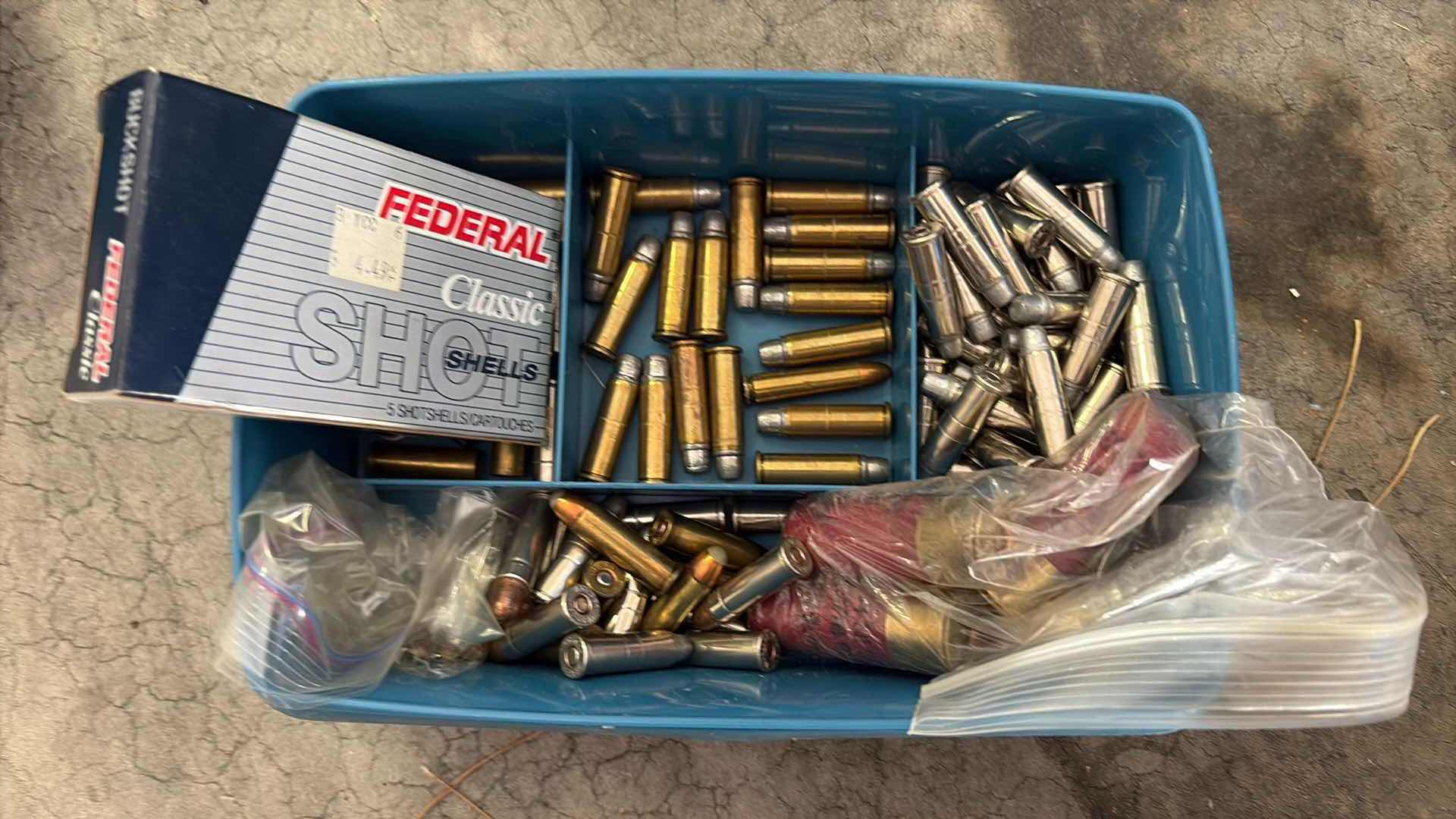 Photo 1 of SMALL PLASTIC CONTAINER FULL OF LOOSE AMMUNITION
