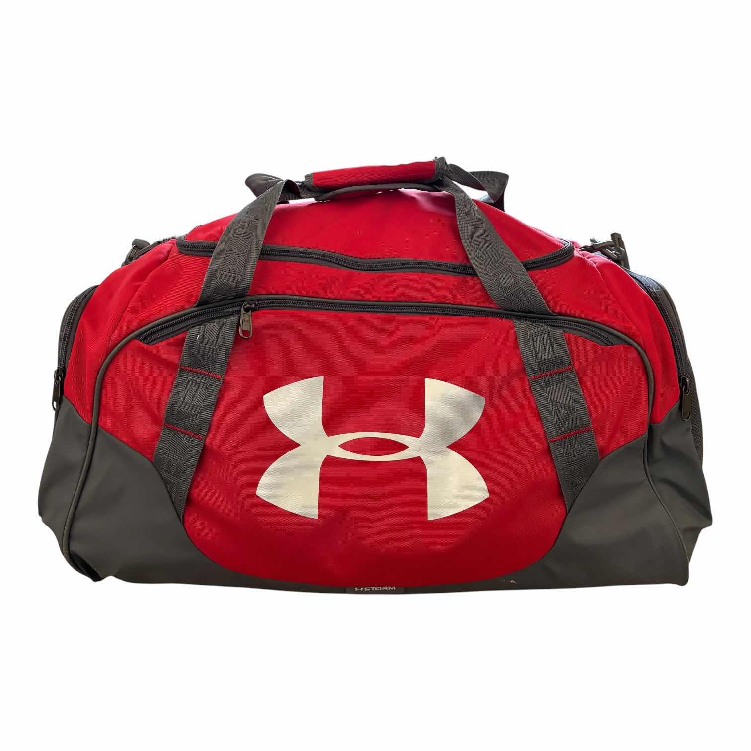 Photo 1 of UNDER ARMOUR DUFFLE BAG FULL OF SNOW GEAR FOR LITTLE GIRLS SIZE 130