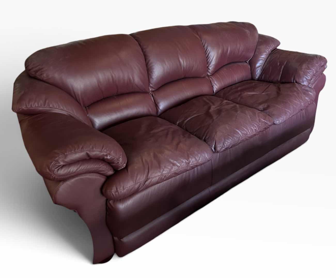 Photo 1 of 8’ TRADITIONAL THREE-SEATER LIVING ROOM SOFA UPHOLSTERED IN A RICH, DEEP BURGUNDY OXBLOOD PLEATHER.