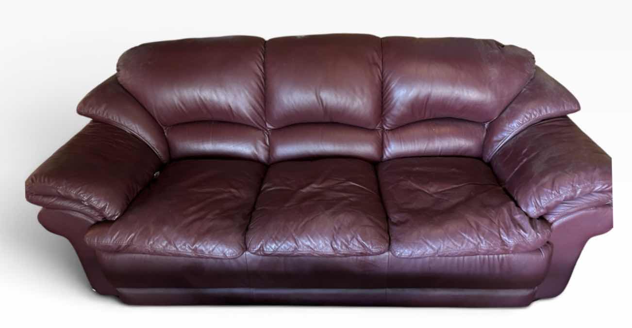 Photo 1 of 8’ TRADITIONAL THREE-SEATER LIVING ROOM SOFA UPHOLSTERED IN A RICH, DEEP BURGUNDY OXBLOOD PLEATHER.
