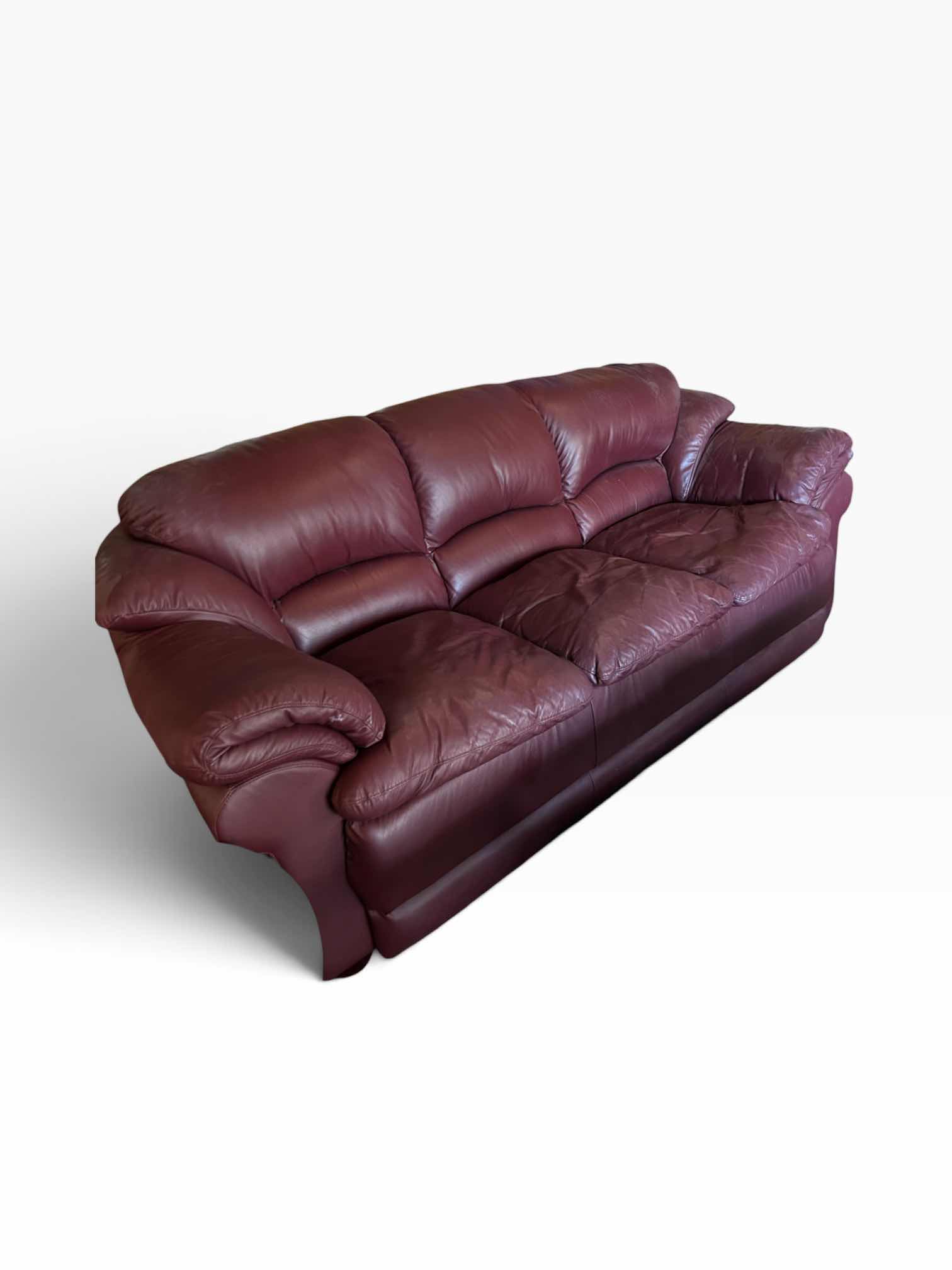 Photo 1 of 8’ TRADITIONAL THREE-SEATER LIVING ROOM SOFA UPHOLSTERED IN A RICH, DEEP BURGUNDY OXBLOOD PLEATHER.