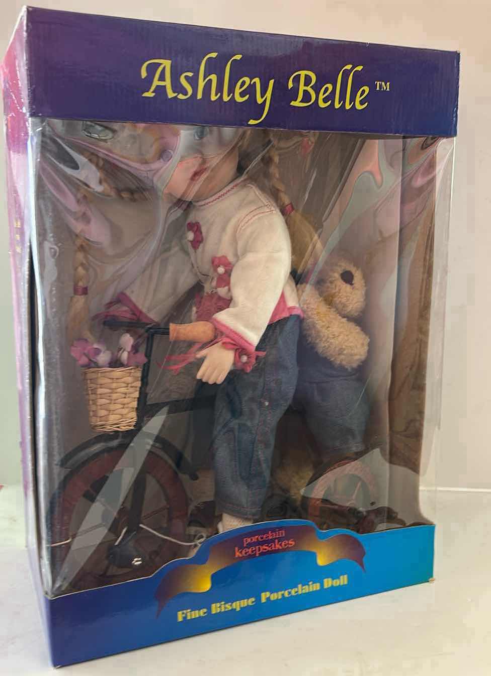 Photo 1 of NIB - VINTAGE ASHLEY BELLE "PORCELAIN KEEPSAKES" 16-INCH FINE BISQUE PORCELAIN DOLL RIDING A BICYCLE. $40