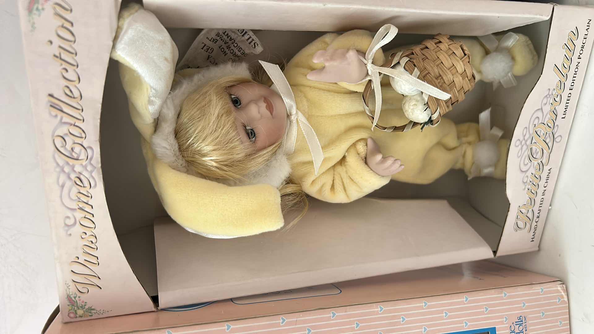View 3 of 3 NIB 8” DOLLS - VOGUE GINNY CHEERLEADER DOLL, "PETITE PORCELAINS" BUNNY BABY DOLL & VOGUE "THE WORLD OF GINNY" VINYL DOLL.