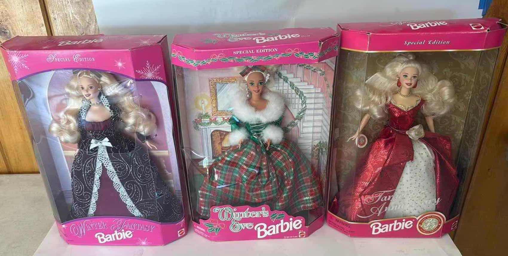 Photo 1 of 3- NIB WINTER BARBIES $80