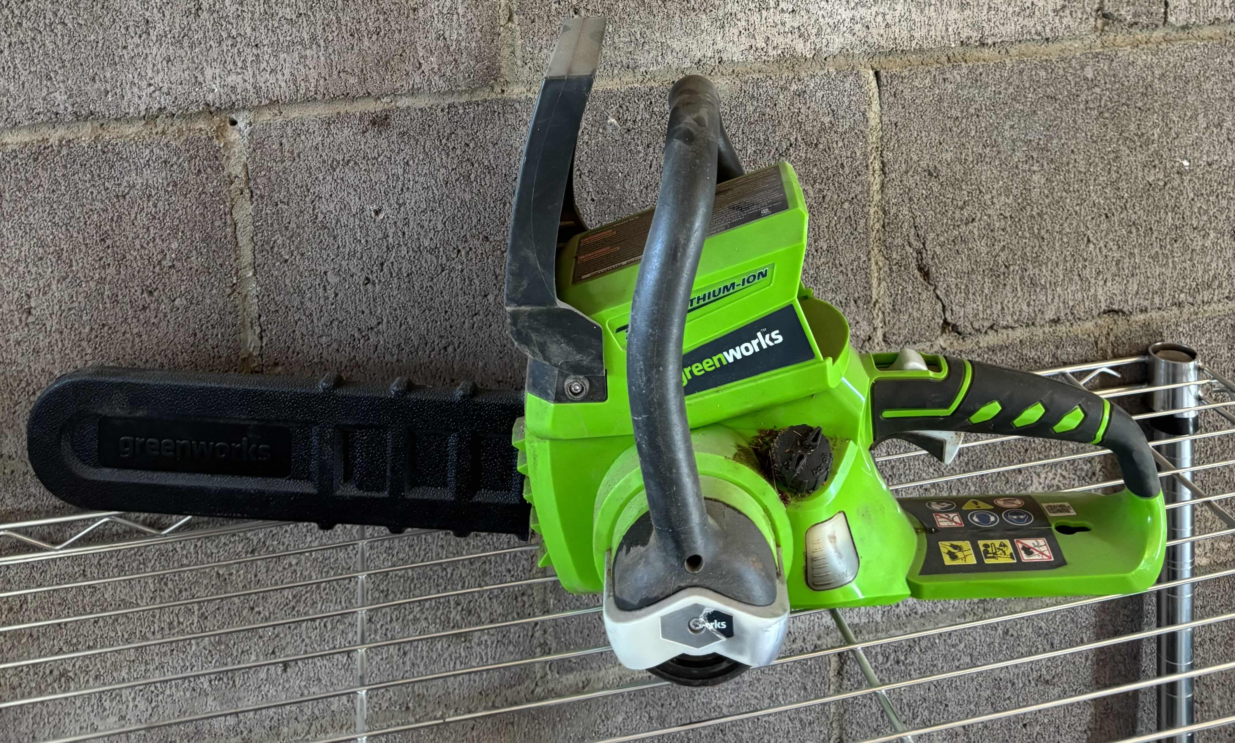 Photo 1 of GREENWORKS CHAINSAW WITH BATTERY AND CHARGER