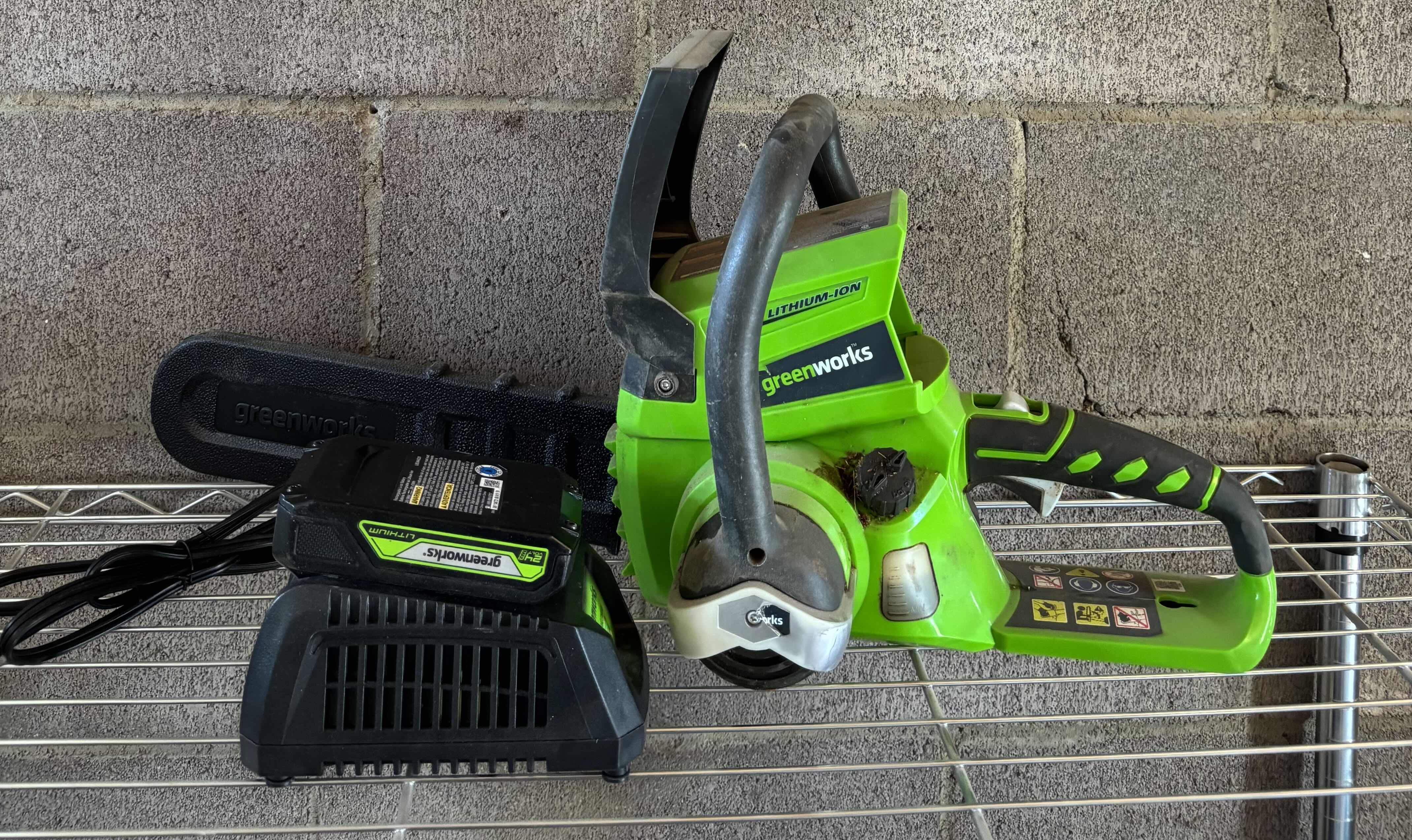Photo 1 of GREENWORKS CHAINSAW WITH BATTERY AND CHARGER